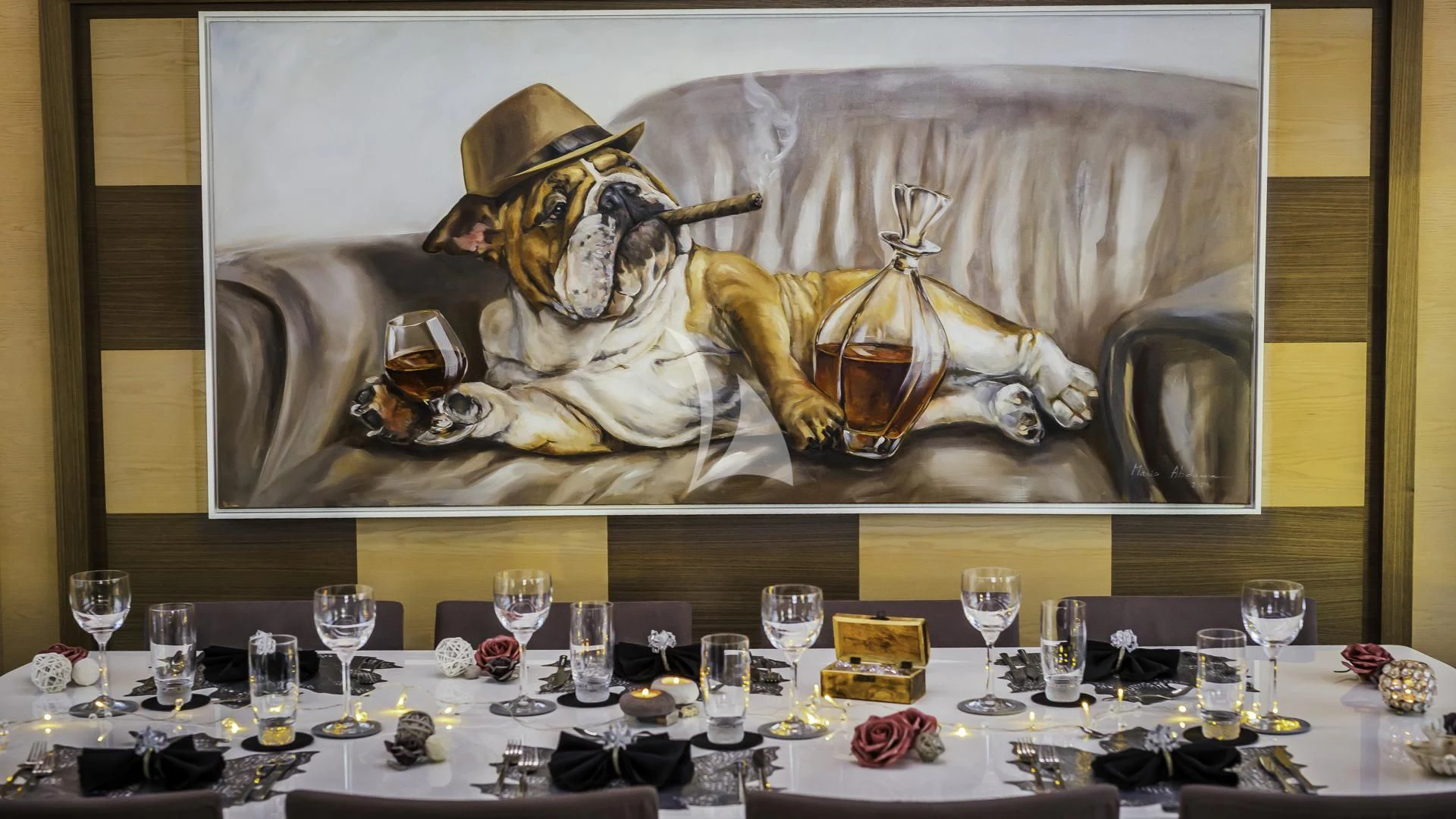 a table with many glasses of wine and a statue aboard OCEAN DRIVE Yacht for Charter