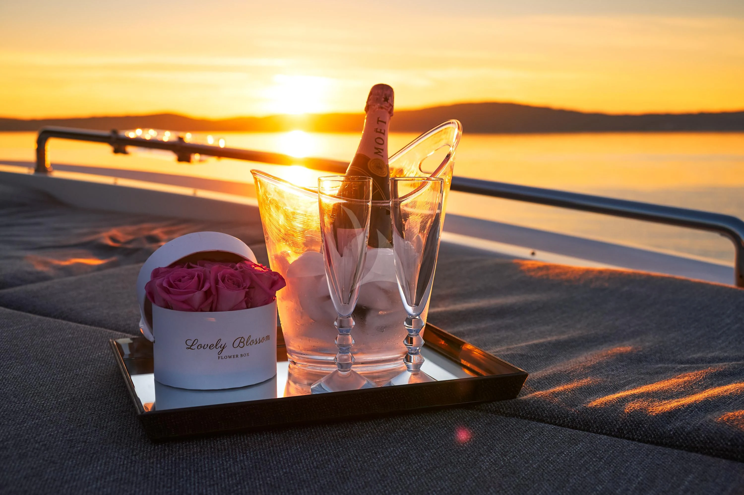 a couple of glasses with ice cream and straws on a tray aboard OCEAN DRIVE Yacht for Charter