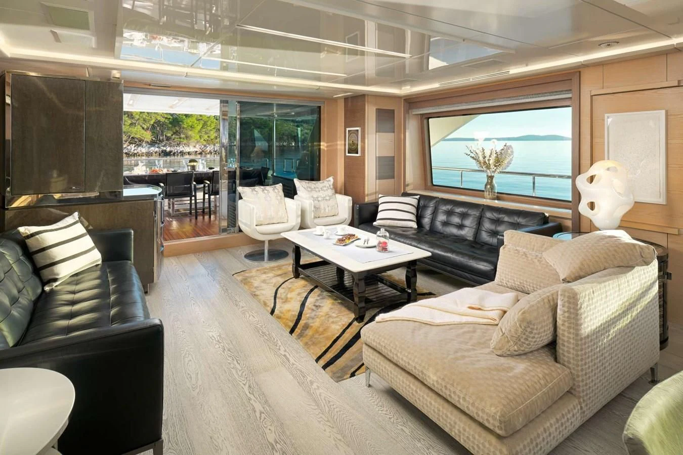 a living room with a large window aboard OCEAN DRIVE Yacht for Charter