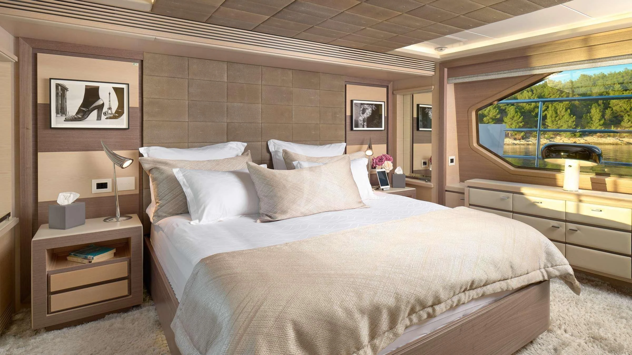 a bed with white sheets aboard OCEAN DRIVE Yacht for Charter