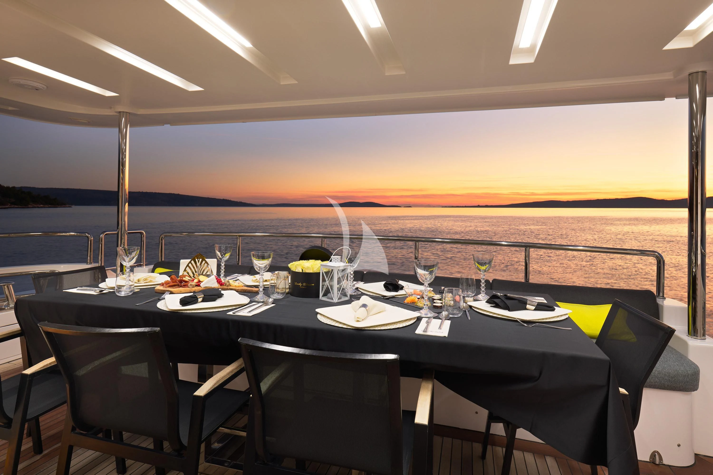 a table set for a dinner party aboard OCEAN DRIVE Yacht for Charter