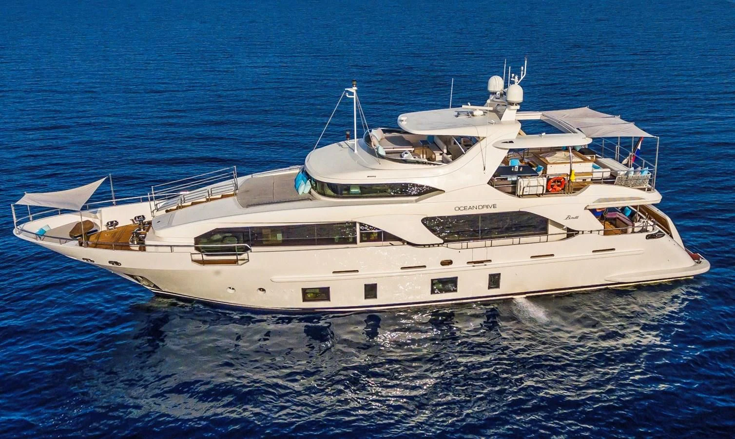 a white yacht in the water aboard OCEAN DRIVE Yacht for Charter