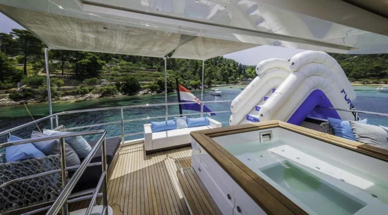 a deck with boats and a canopy over it aboard OCEAN DRIVE Yacht for Charter