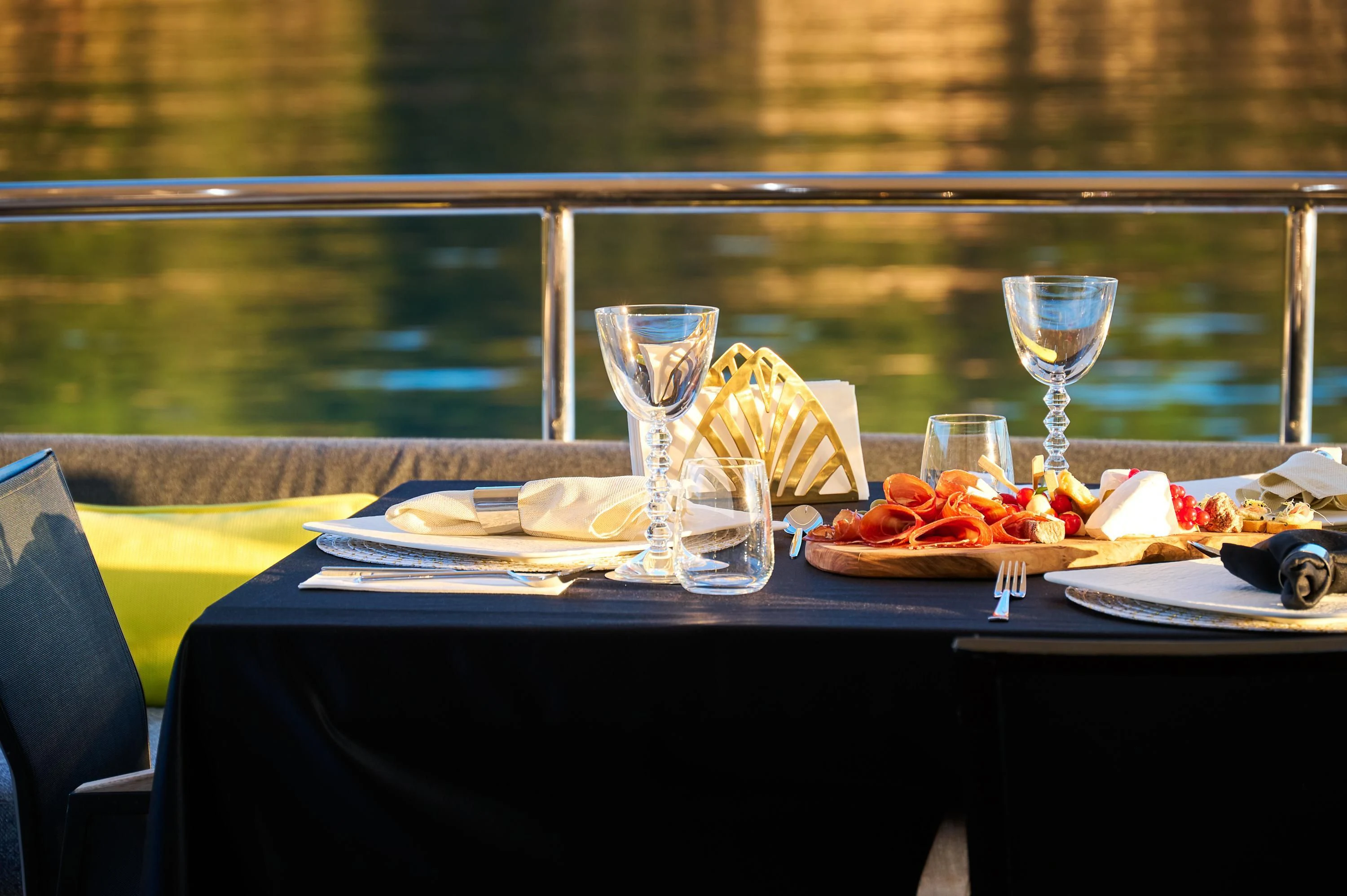 a table with food and wine glasses aboard OCEAN DRIVE Yacht for Charter