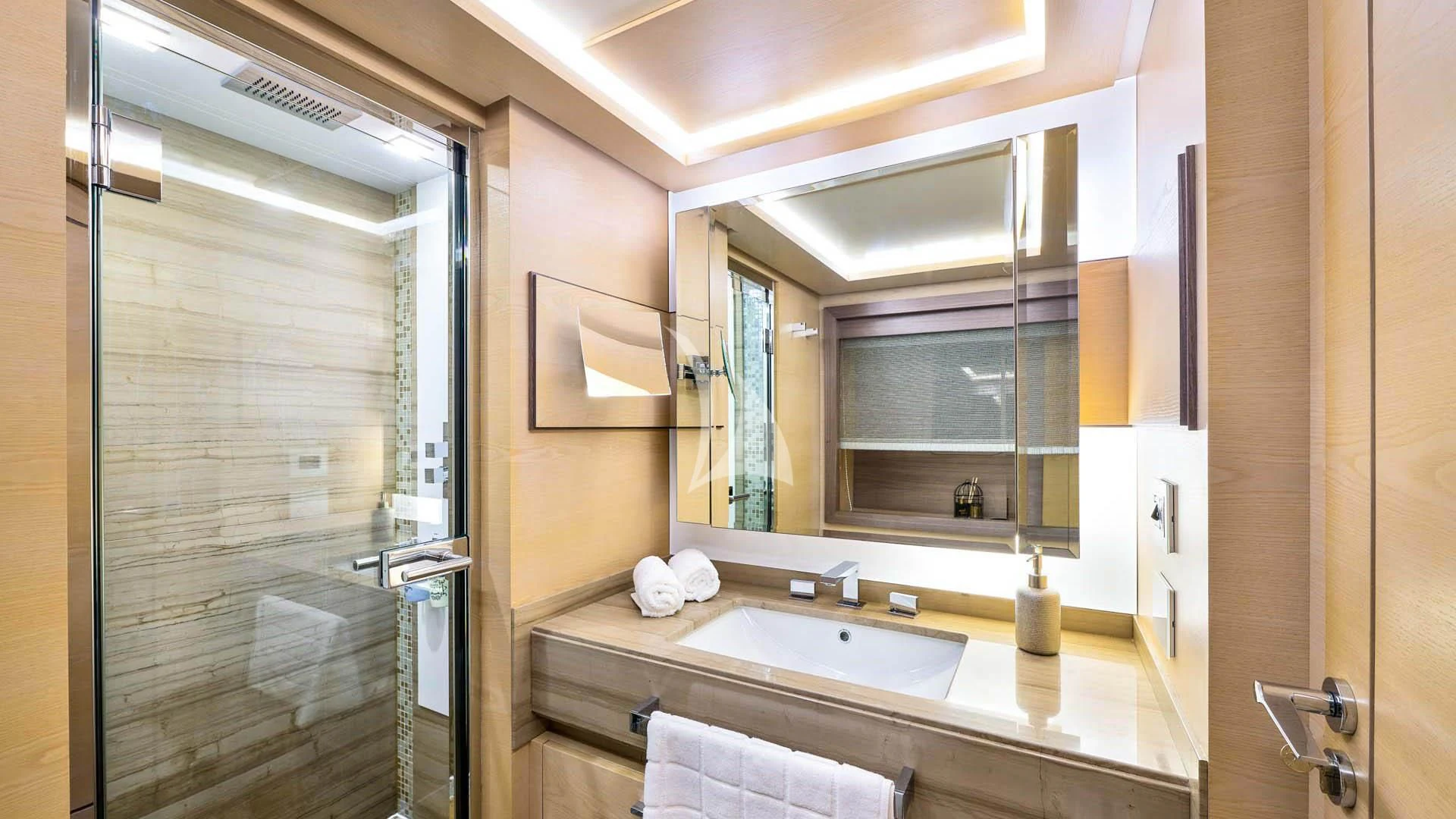 a bathroom with a large mirror aboard OCEAN DRIVE Yacht for Charter