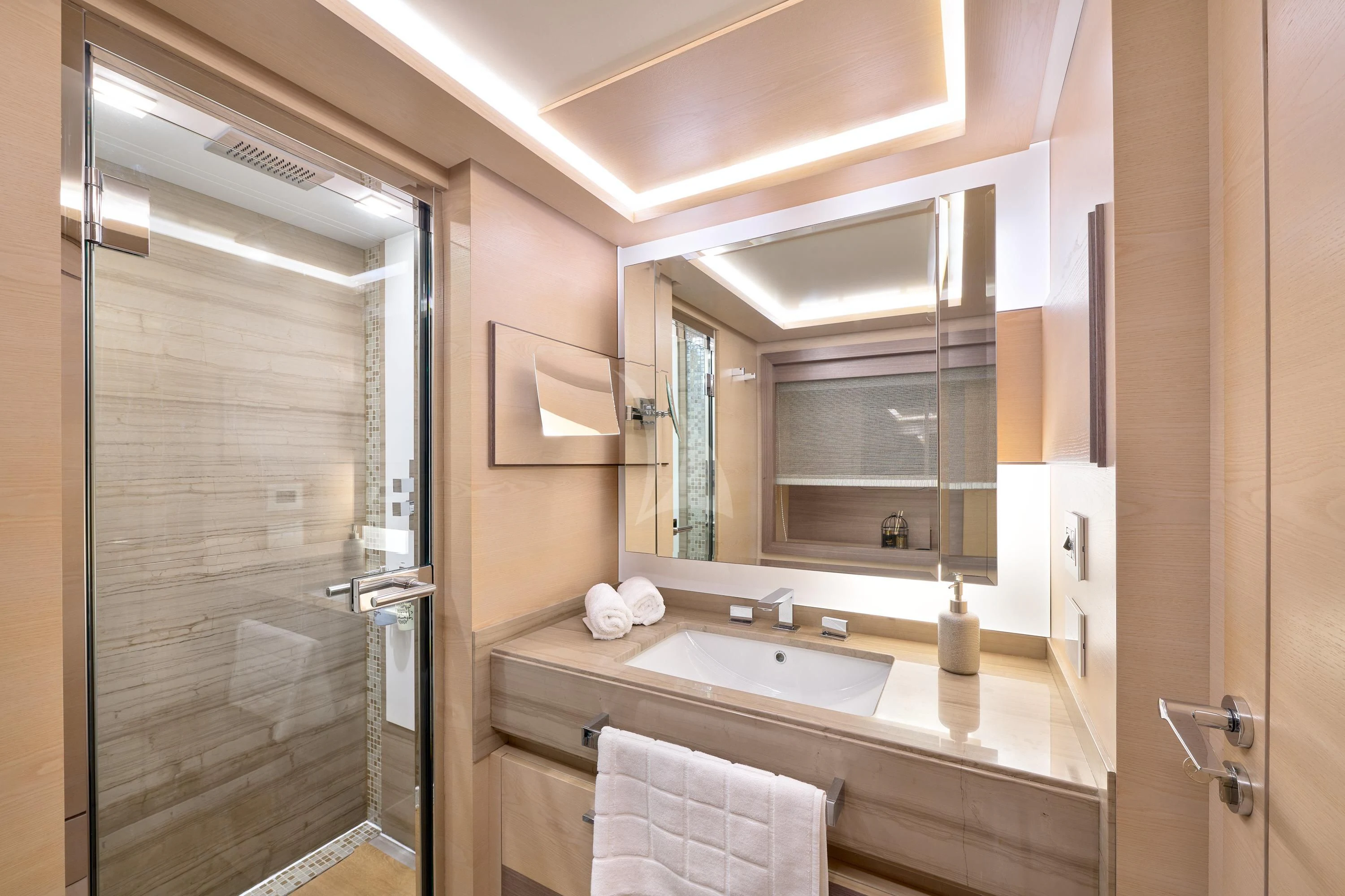 a bathroom with a large mirror aboard OCEAN DRIVE Yacht for Charter