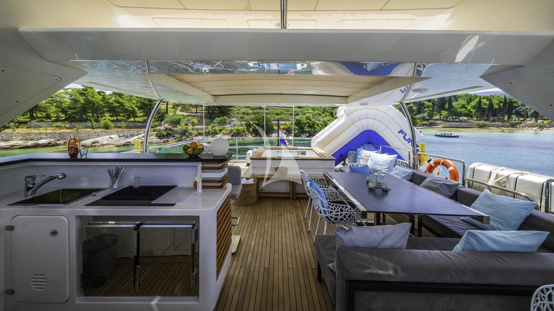 a boat with a table and chairs aboard OCEAN DRIVE Yacht for Charter