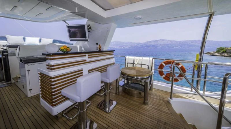 a boat with a bar and chairs aboard OCEAN DRIVE Yacht for Charter