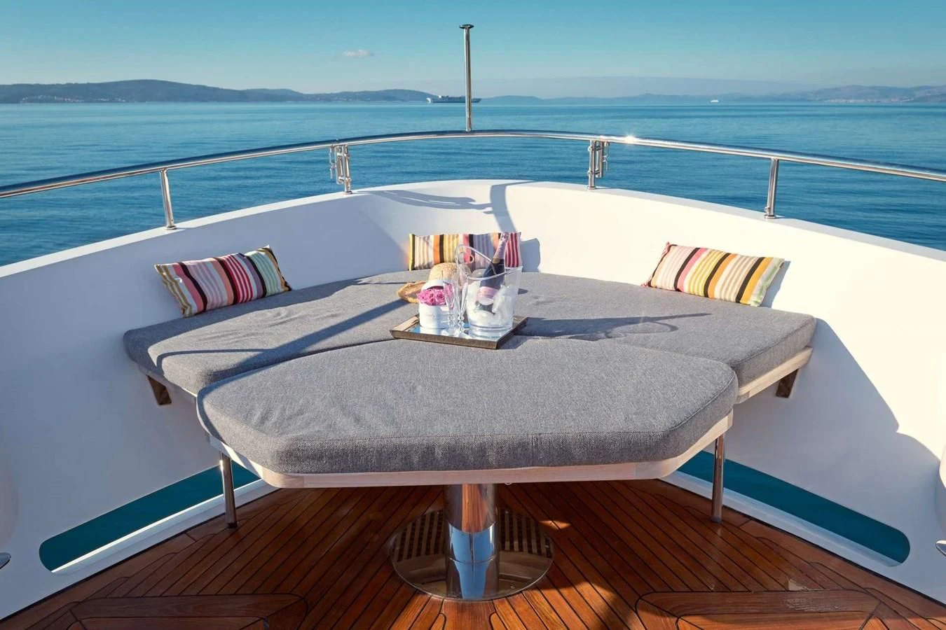 a table on a balcony aboard OCEAN DRIVE Yacht for Charter