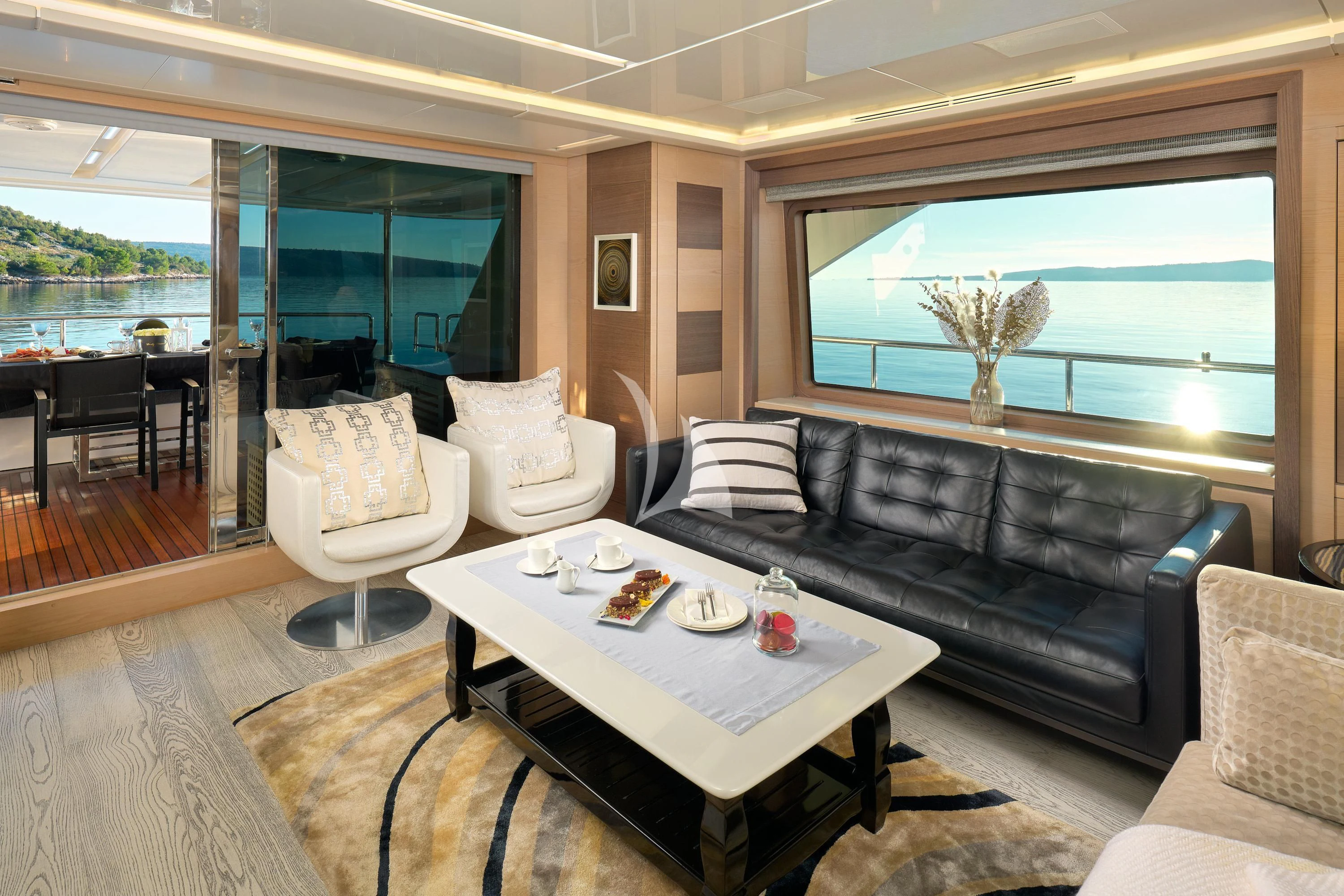 a living room with a couch and a coffee table aboard OCEAN DRIVE Yacht for Charter