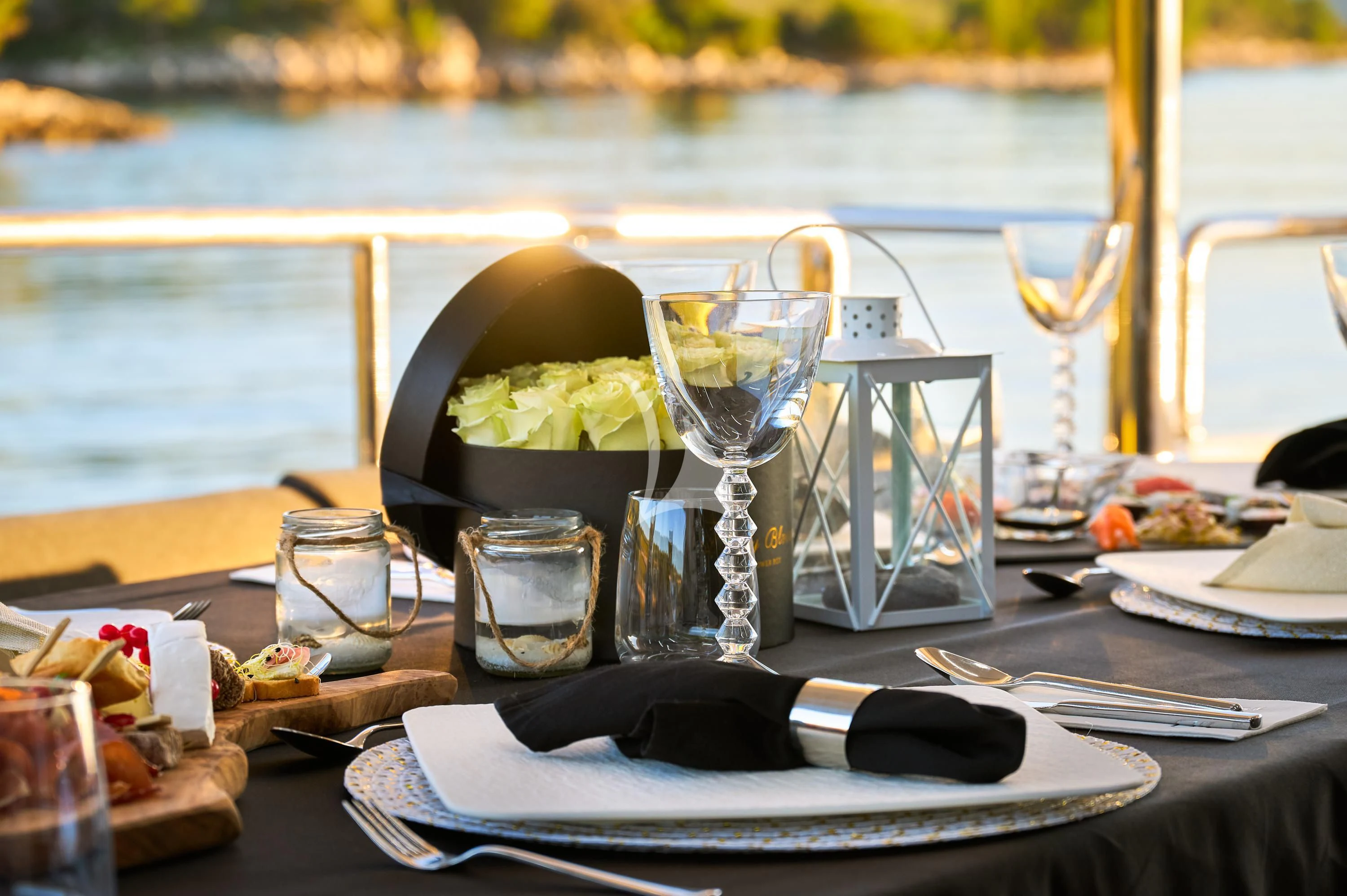 a table with food and glasses on it aboard OCEAN DRIVE Yacht for Charter