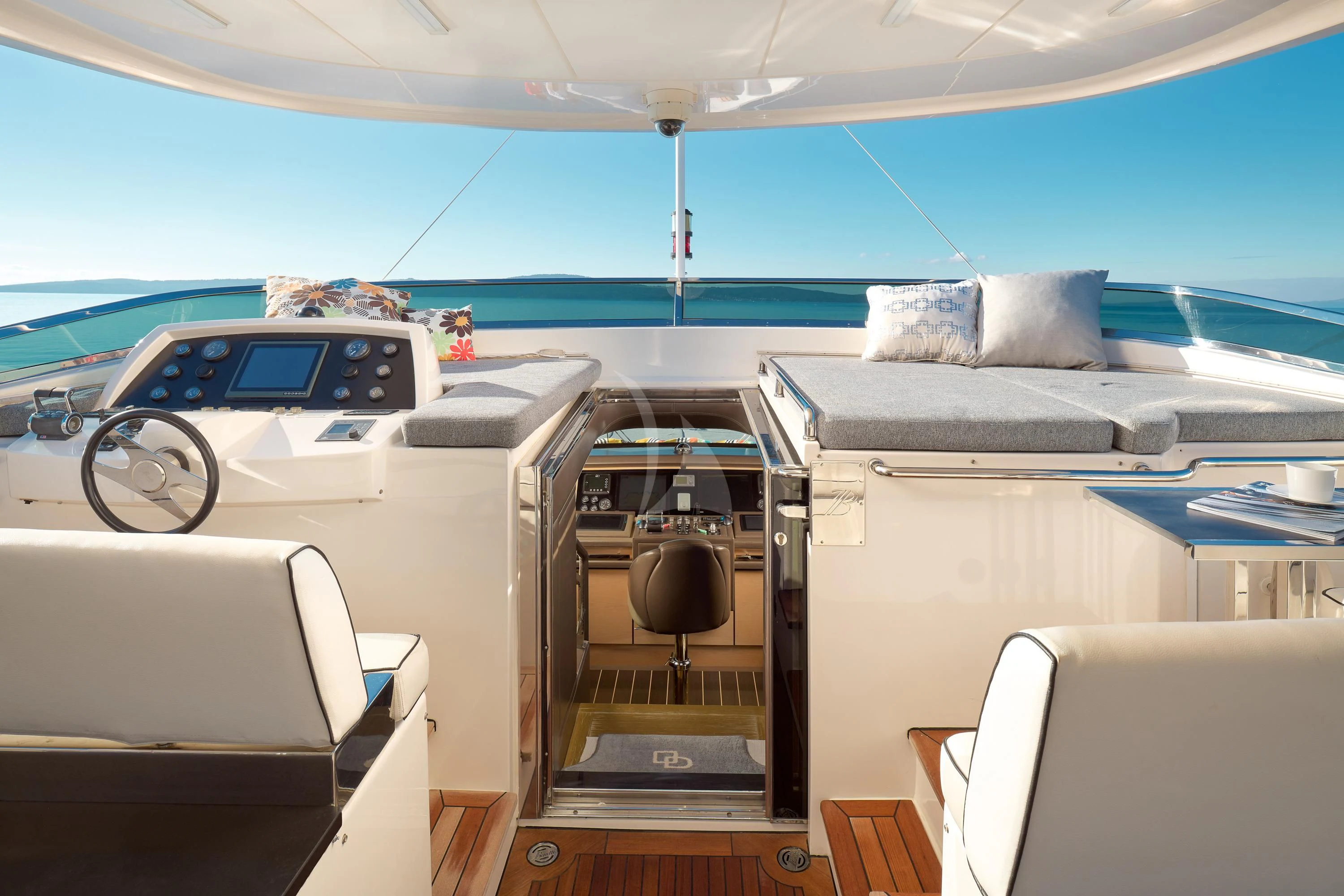 a boat with a car and a bed on the deck aboard OCEAN DRIVE Yacht for Charter