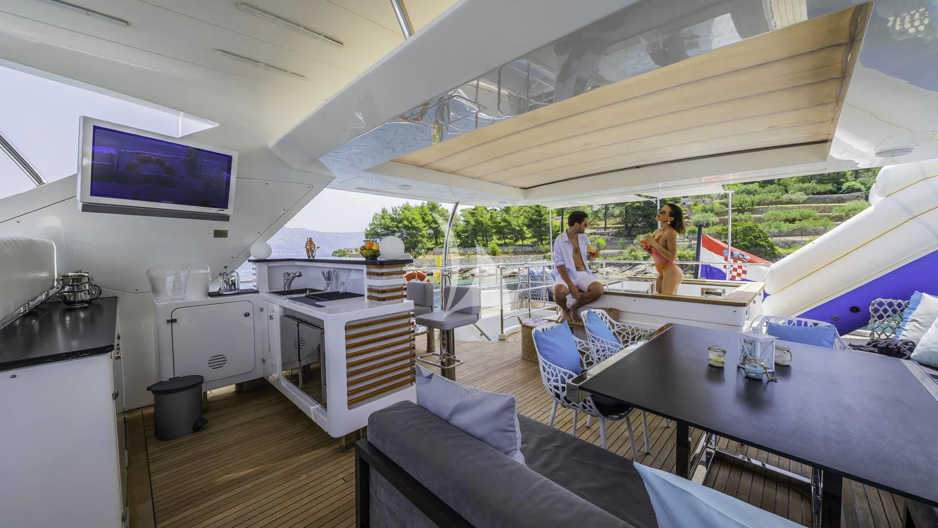 a man and woman in a tent aboard OCEAN DRIVE Yacht for Charter