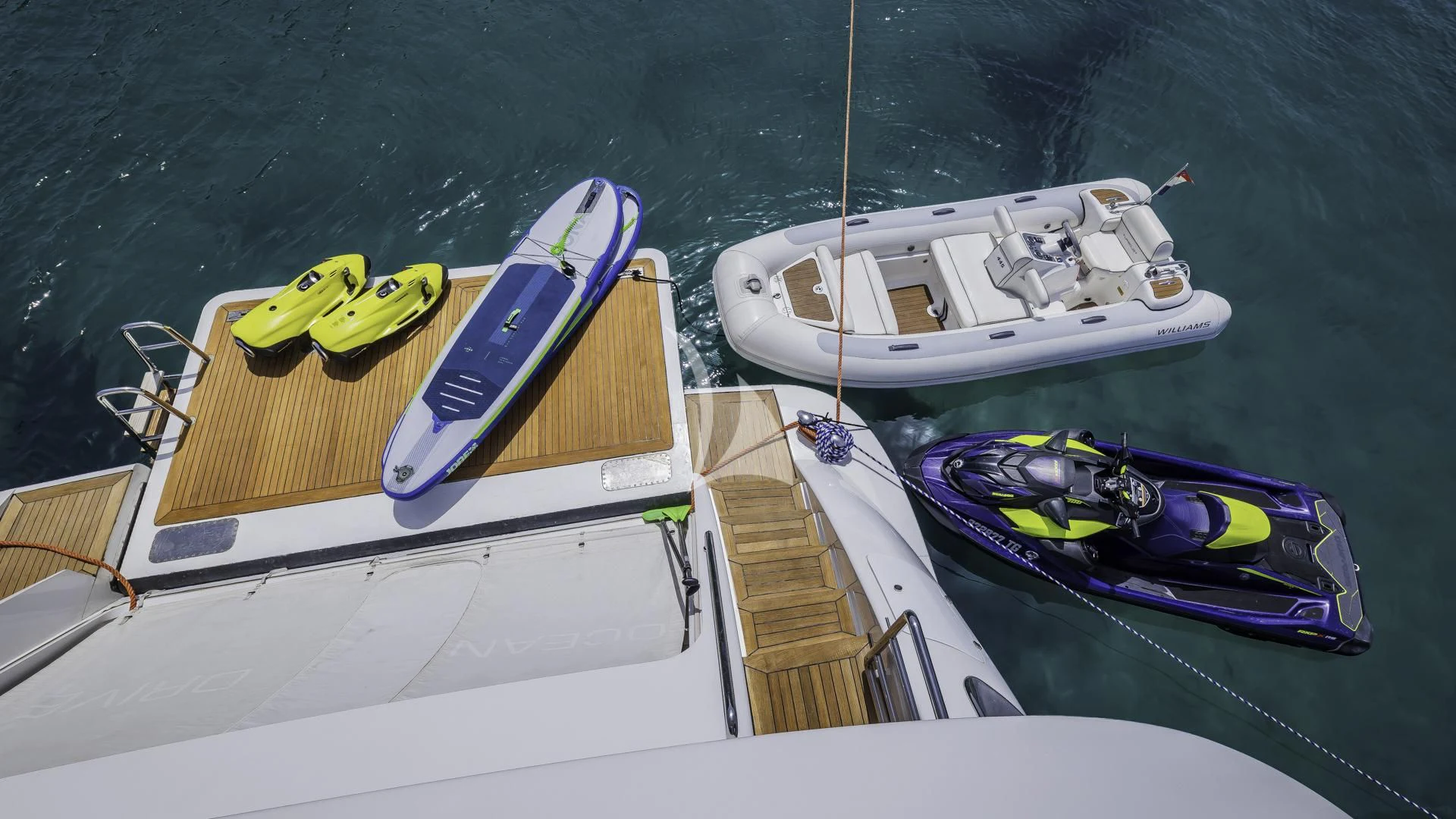 a couple of boats sit on a dock aboard OCEAN DRIVE Yacht for Charter