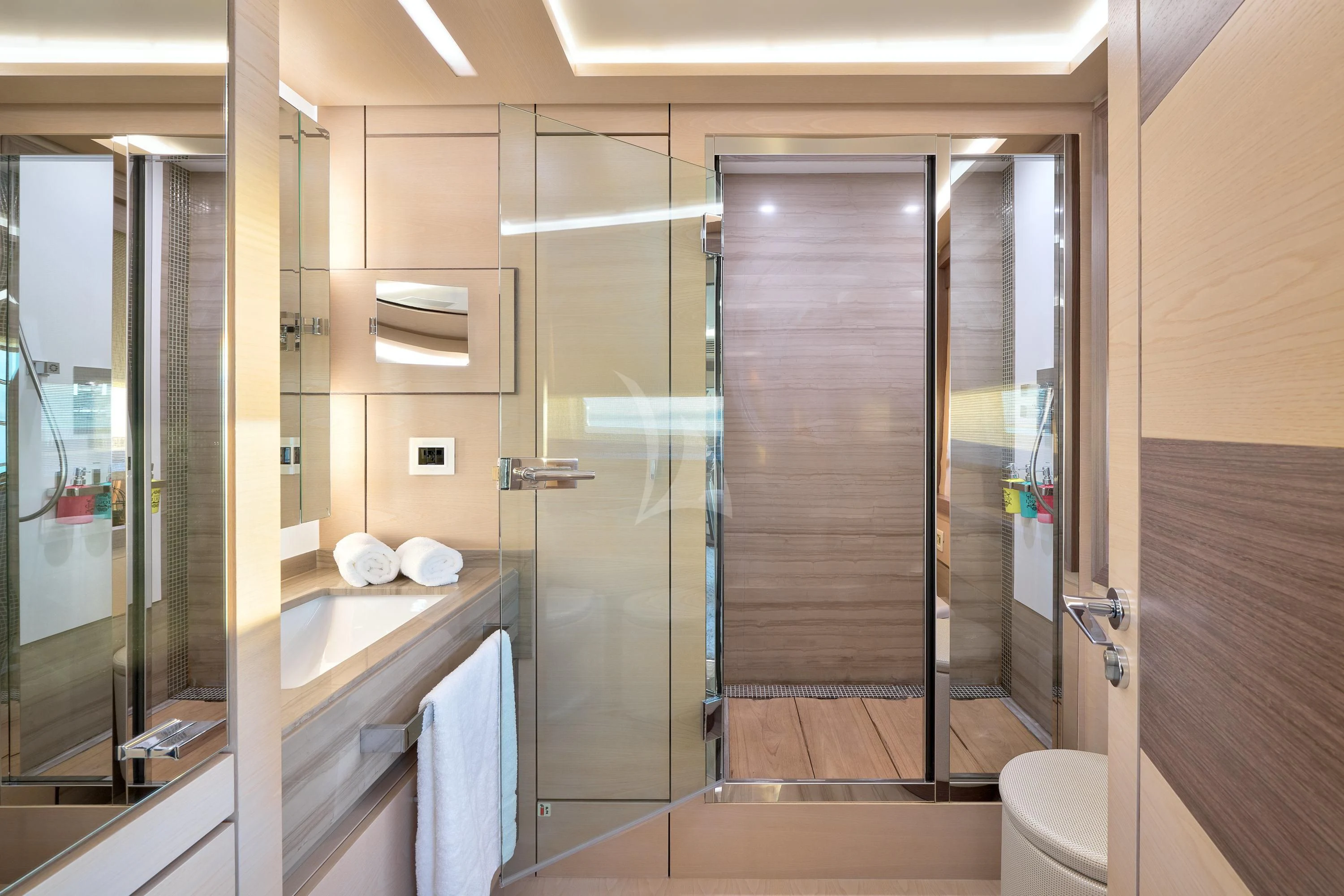 a bathroom with a glass shower aboard OCEAN DRIVE Yacht for Charter