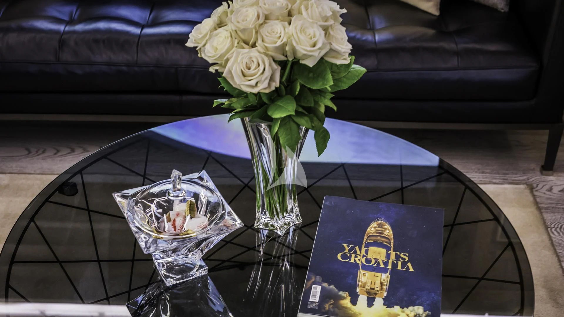a vase of flowers on a table aboard OCEAN DRIVE Yacht for Charter