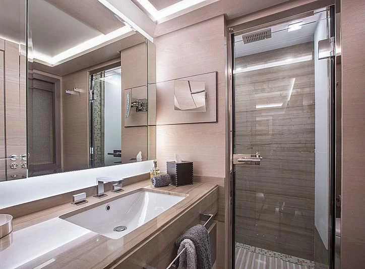 a bathroom with a sink and a shower unit aboard OCEAN DRIVE Yacht for Charter