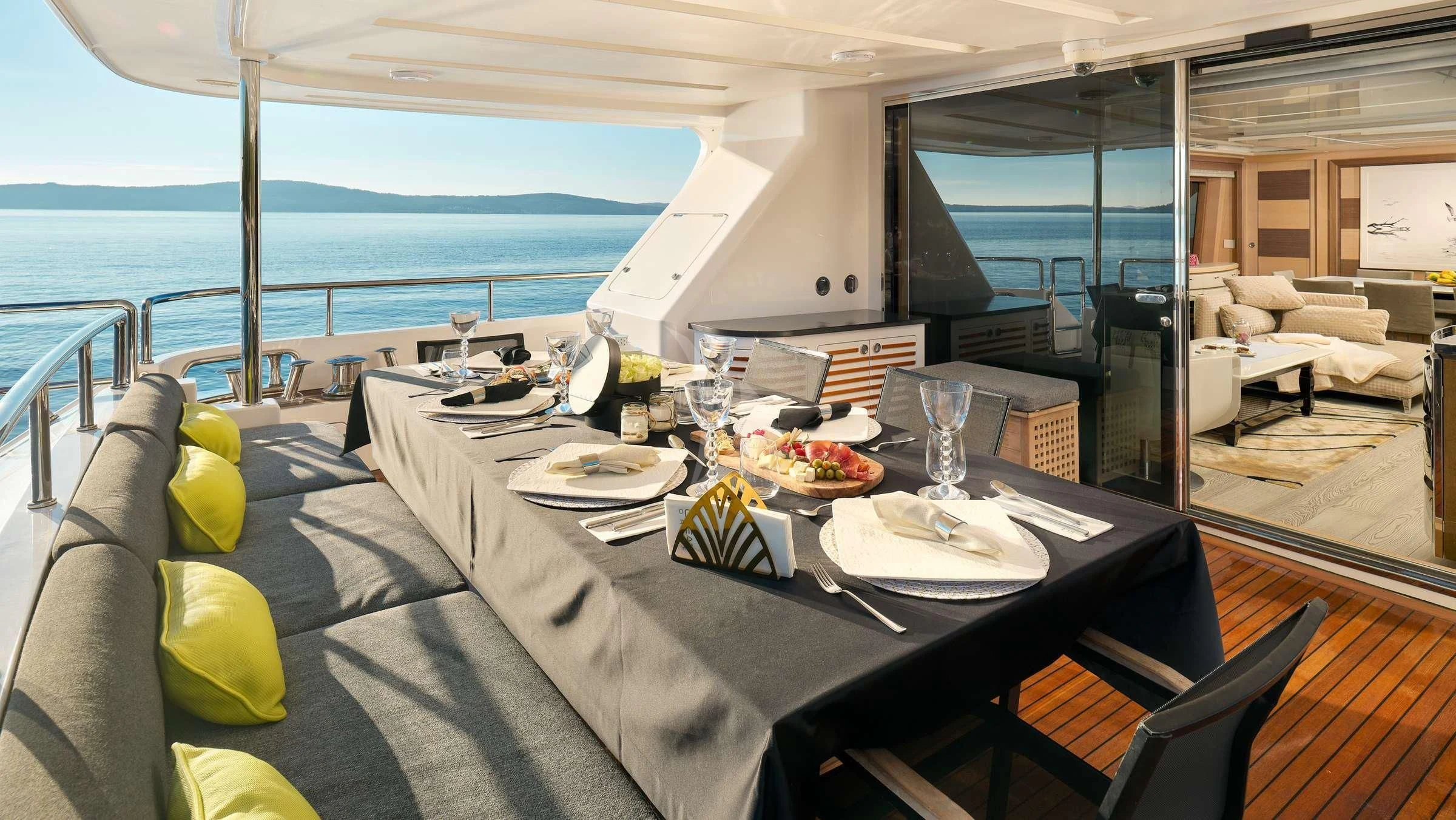 a table with plates and food on it aboard OCEAN DRIVE Yacht for Charter