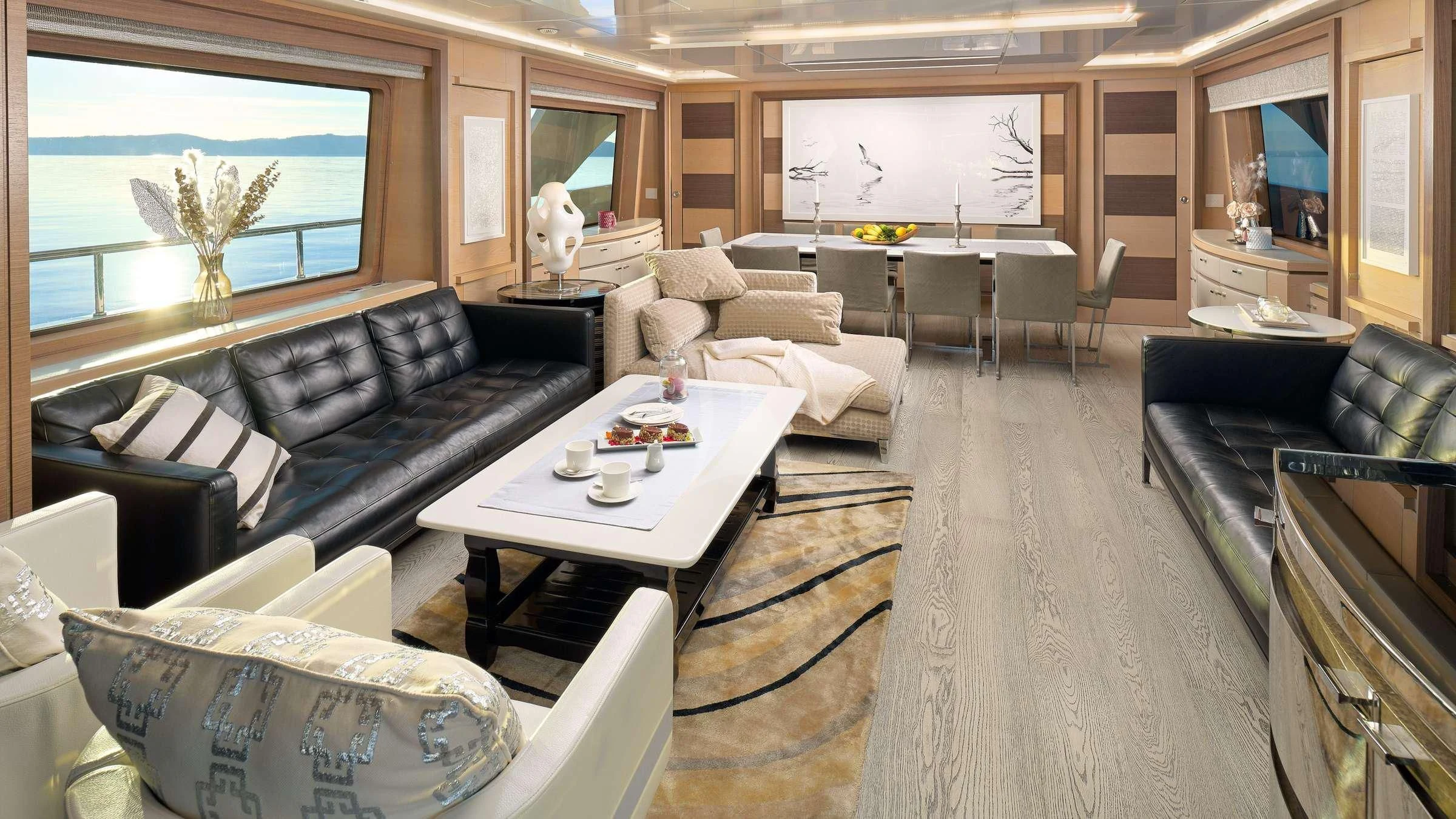 a living room with a couch and a coffee table aboard OCEAN DRIVE Yacht for Charter