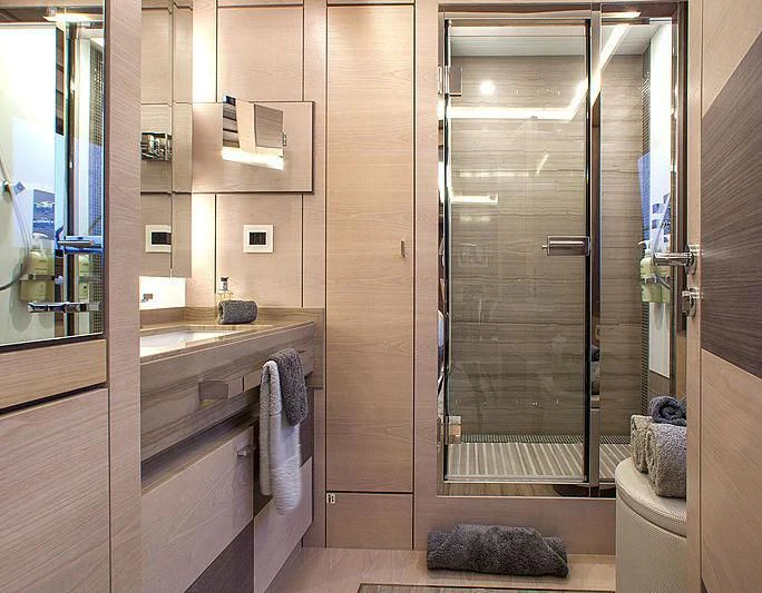 a bathroom with a glass shower aboard OCEAN DRIVE Yacht for Charter
