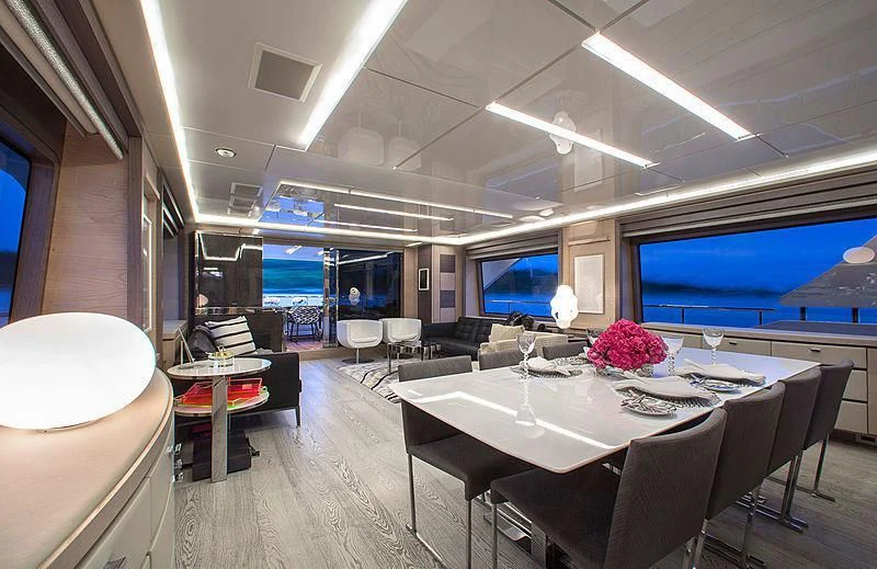a room with a table and chairs aboard OCEAN DRIVE Yacht for Charter