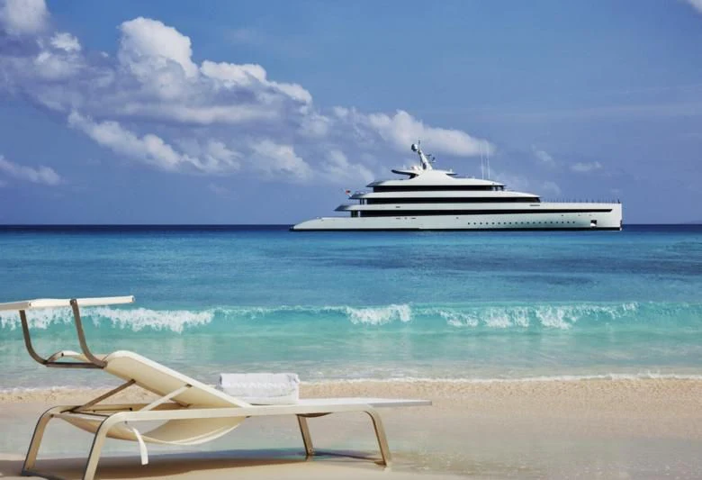 a white boat on a beach aboard SAVANNAH Yacht for Sale