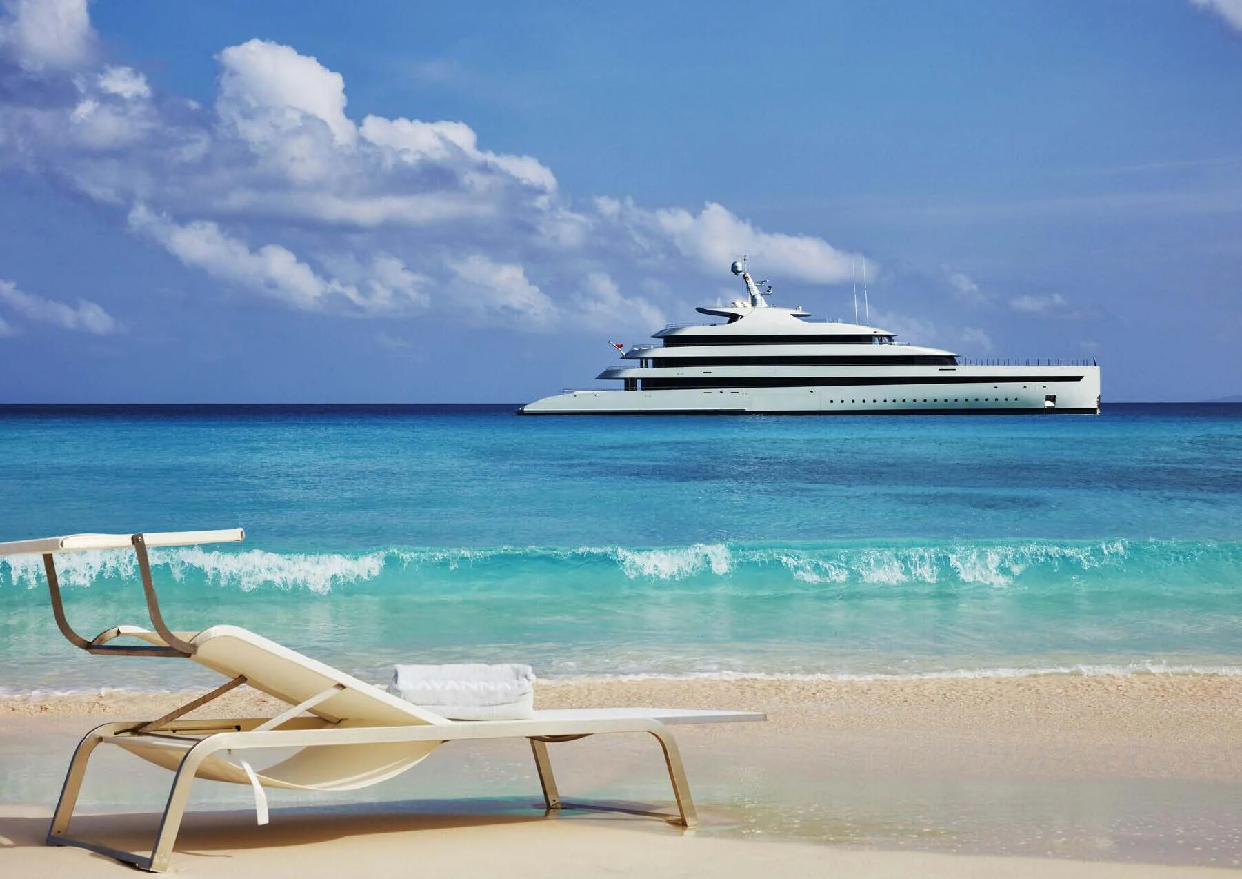 a white boat on a beach aboard SAVANNAH Yacht for Sale