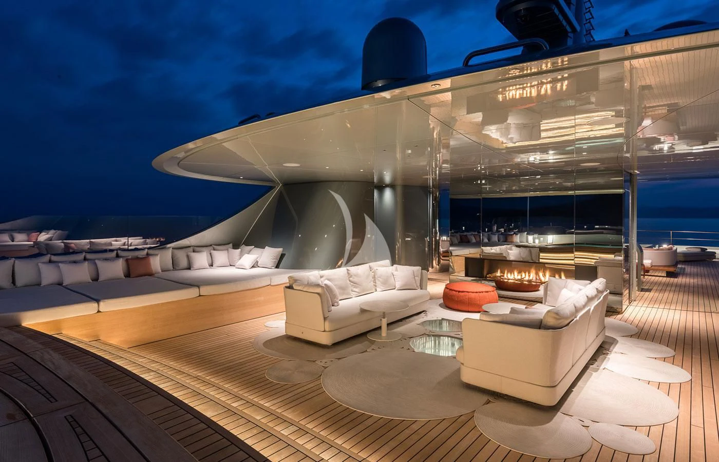 a modern living room with a large glass wall aboard SAVANNAH Yacht for Sale
