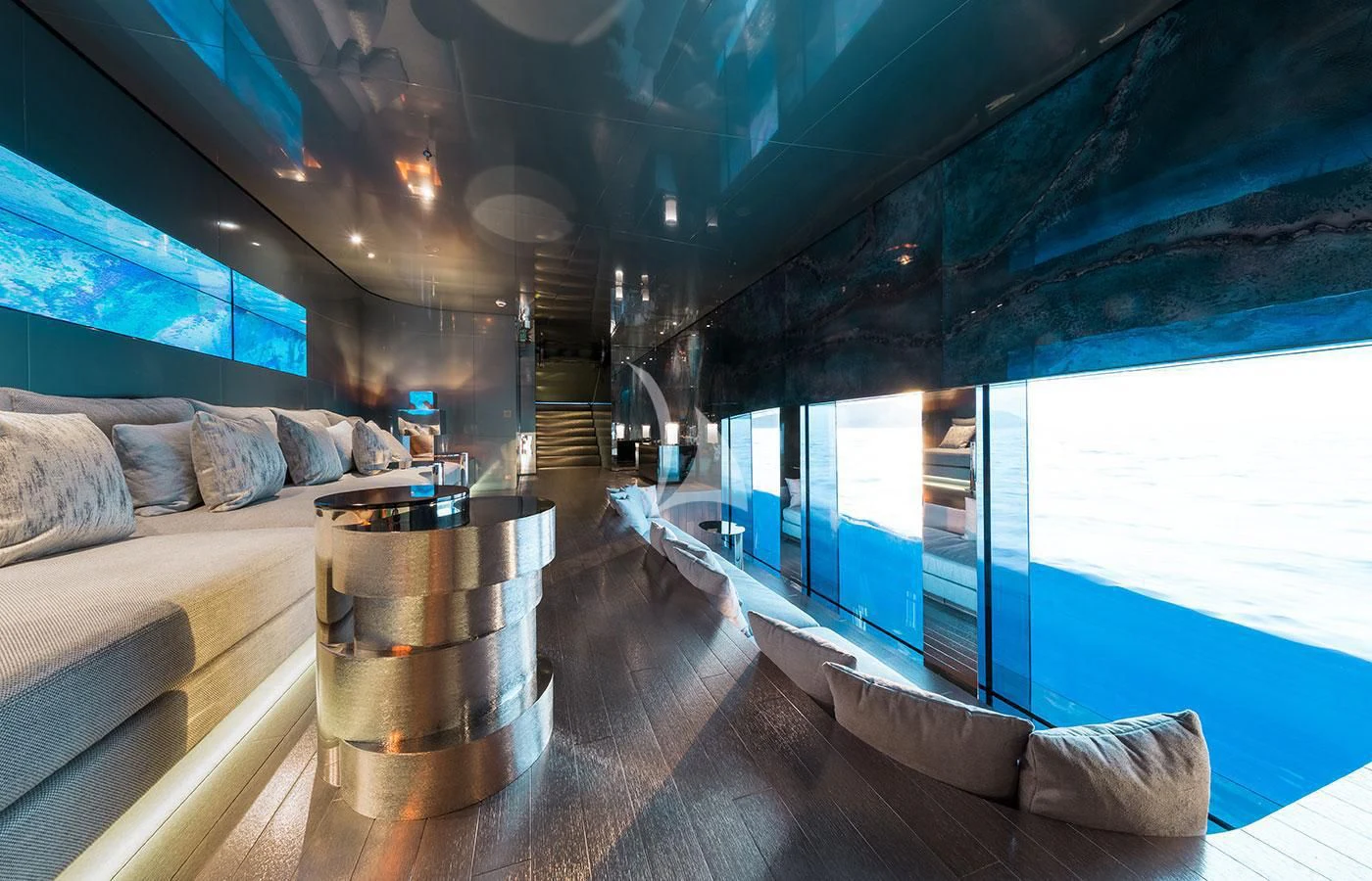 a room with a couch and a table and a window aboard SAVANNAH Yacht for Sale