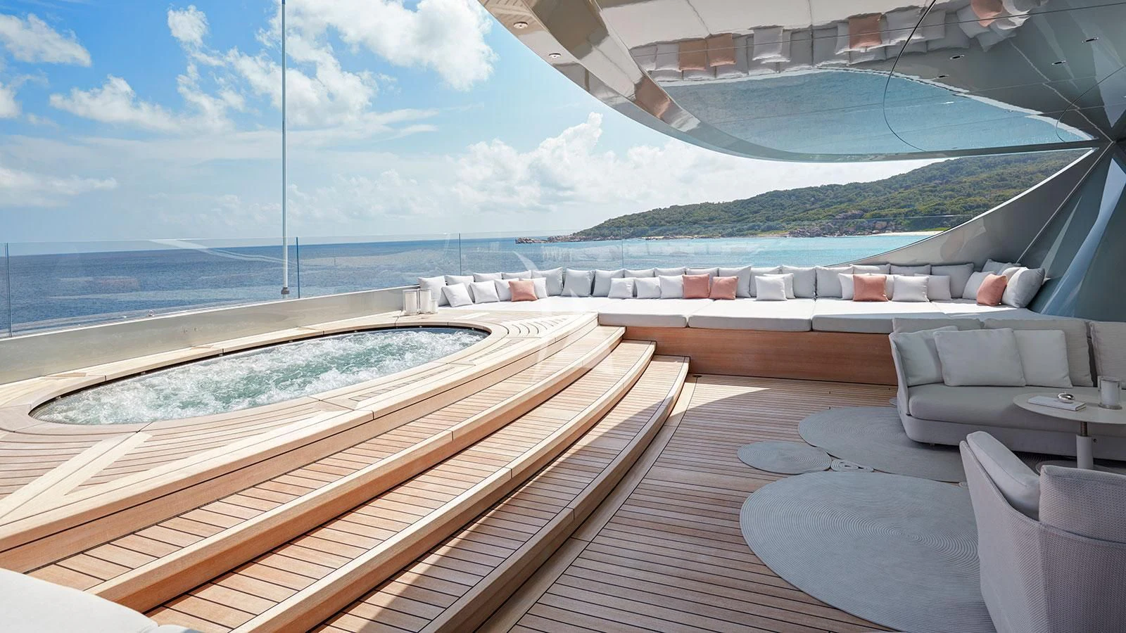 a deck with a pool and a view of the ocean aboard SAVANNAH Yacht for Sale
