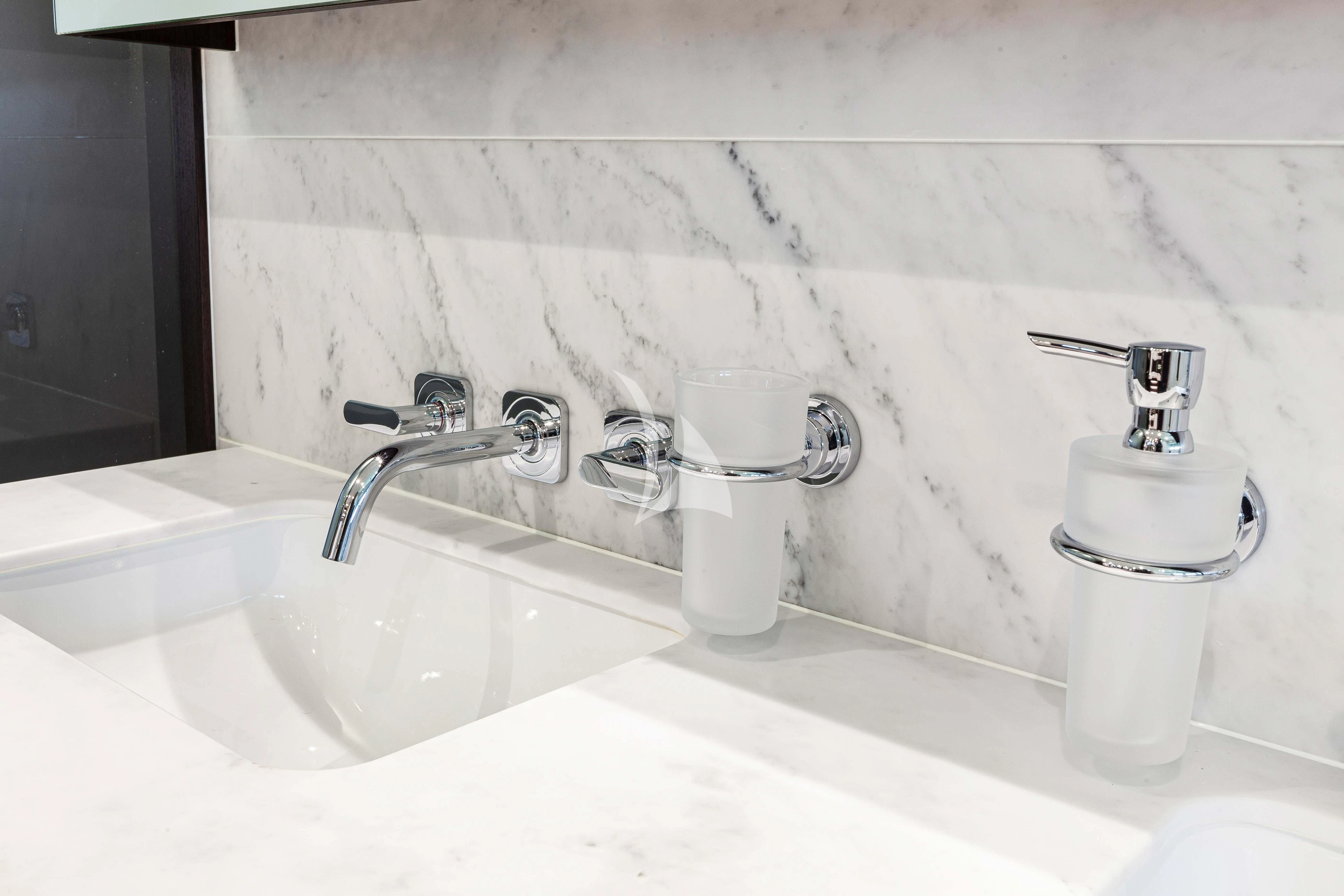 a bathroom with a sink and faucet aboard NEW EDGE Yacht for Sale
