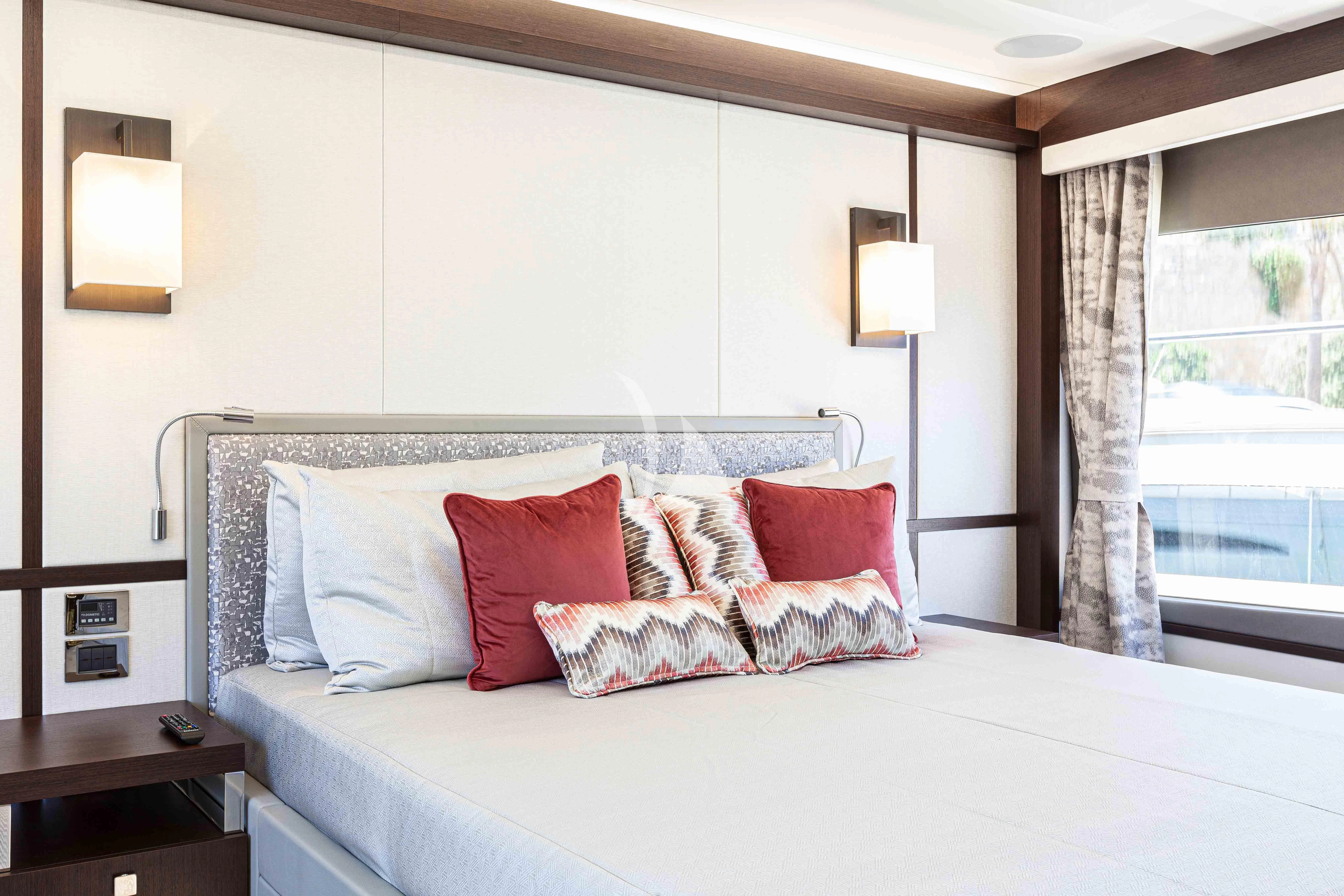 a bed with pillows aboard NEW EDGE Yacht for Sale