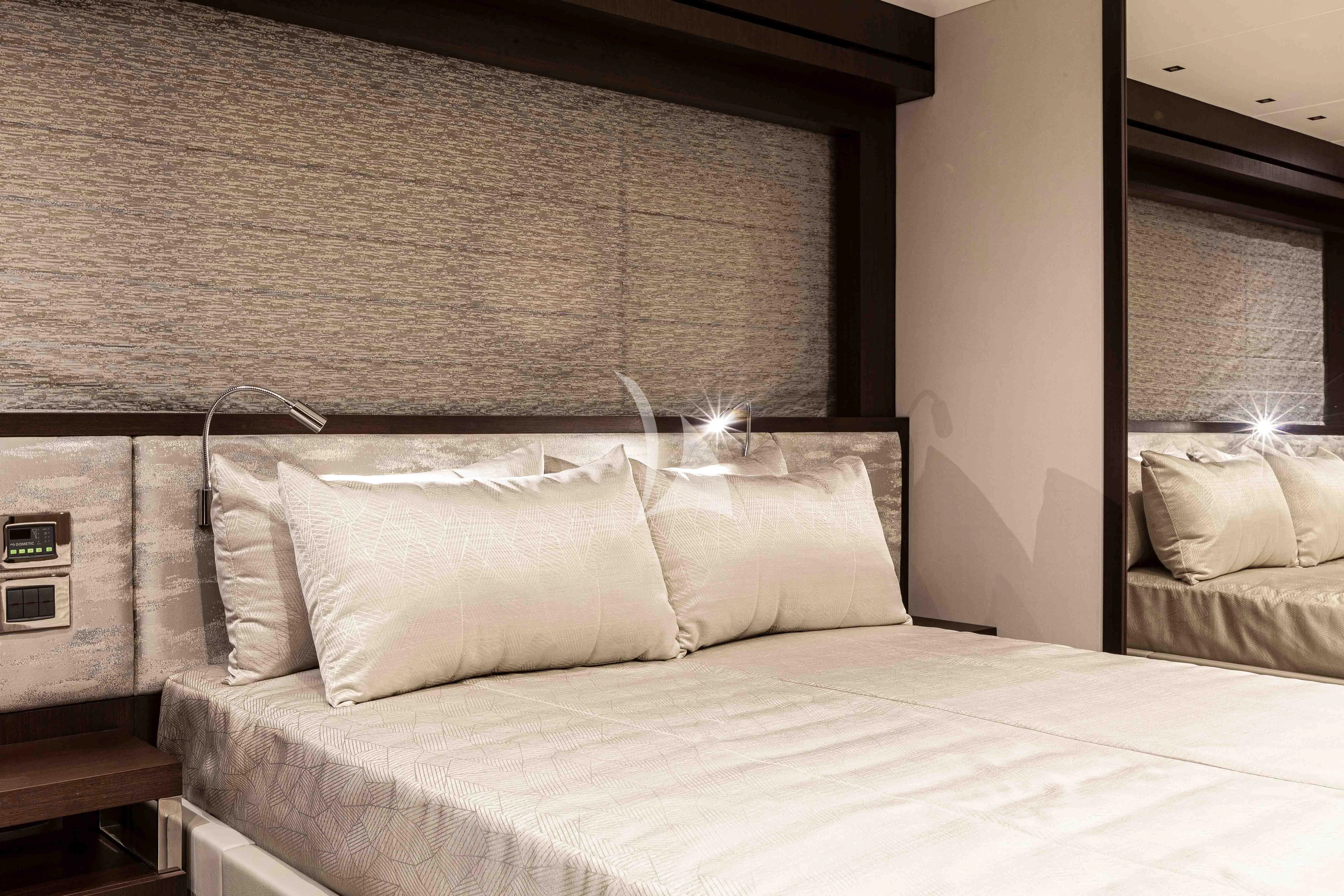 a bed with white sheets aboard NEW EDGE Yacht for Sale