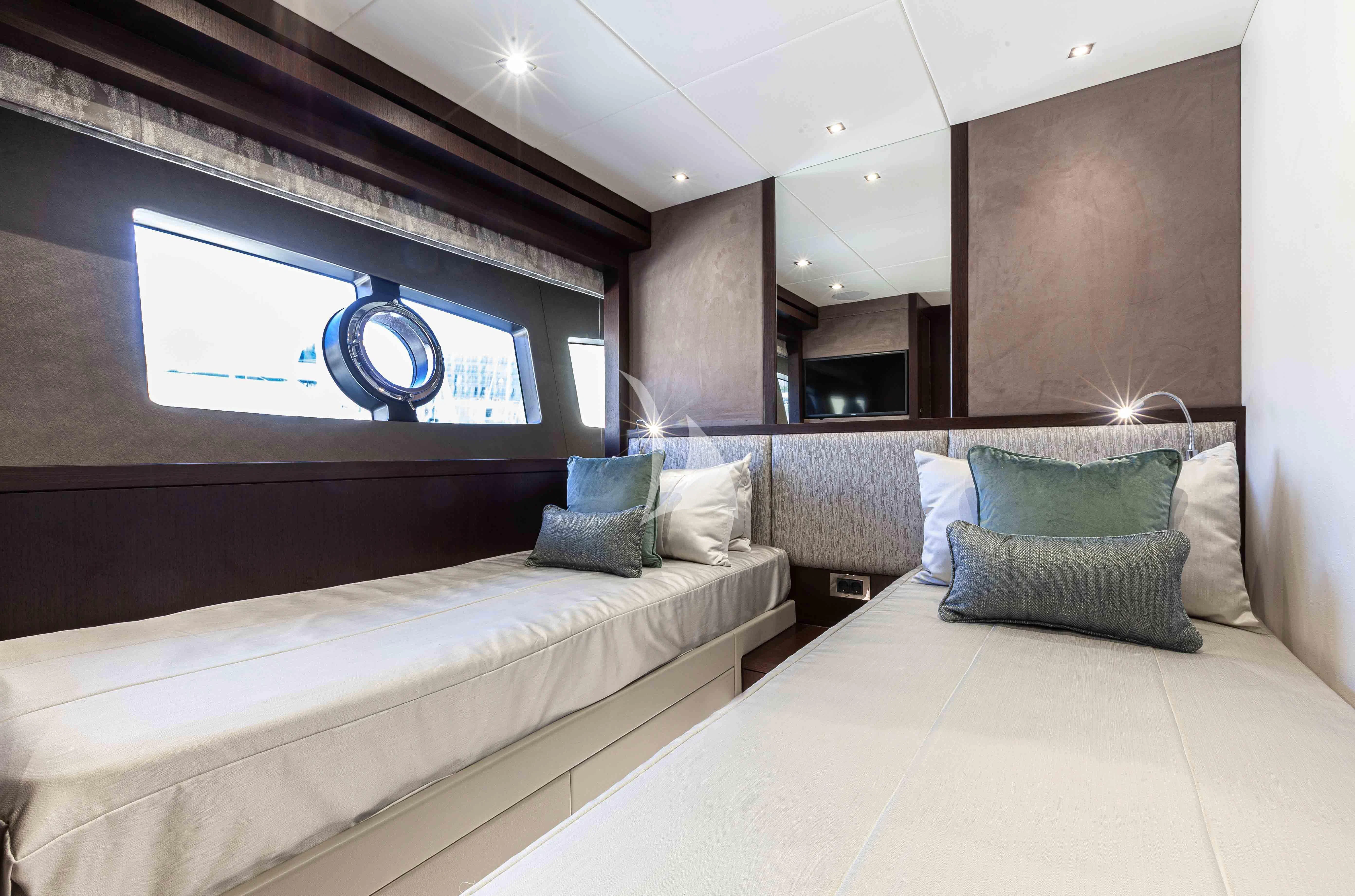 a room with a bed and a tv on the wall aboard NEW EDGE Yacht for Sale