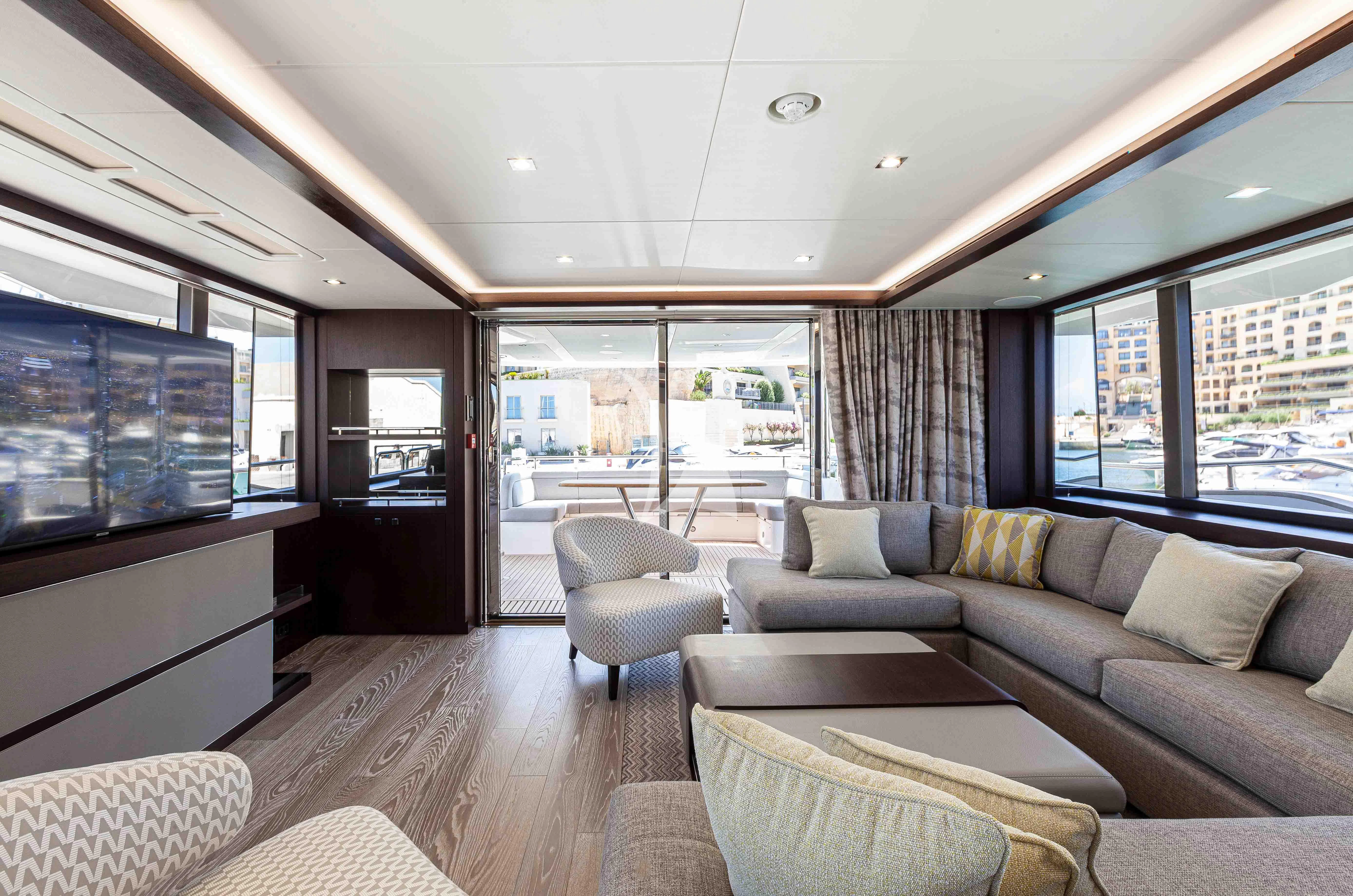 a living room with a large window aboard NEW EDGE Yacht for Sale