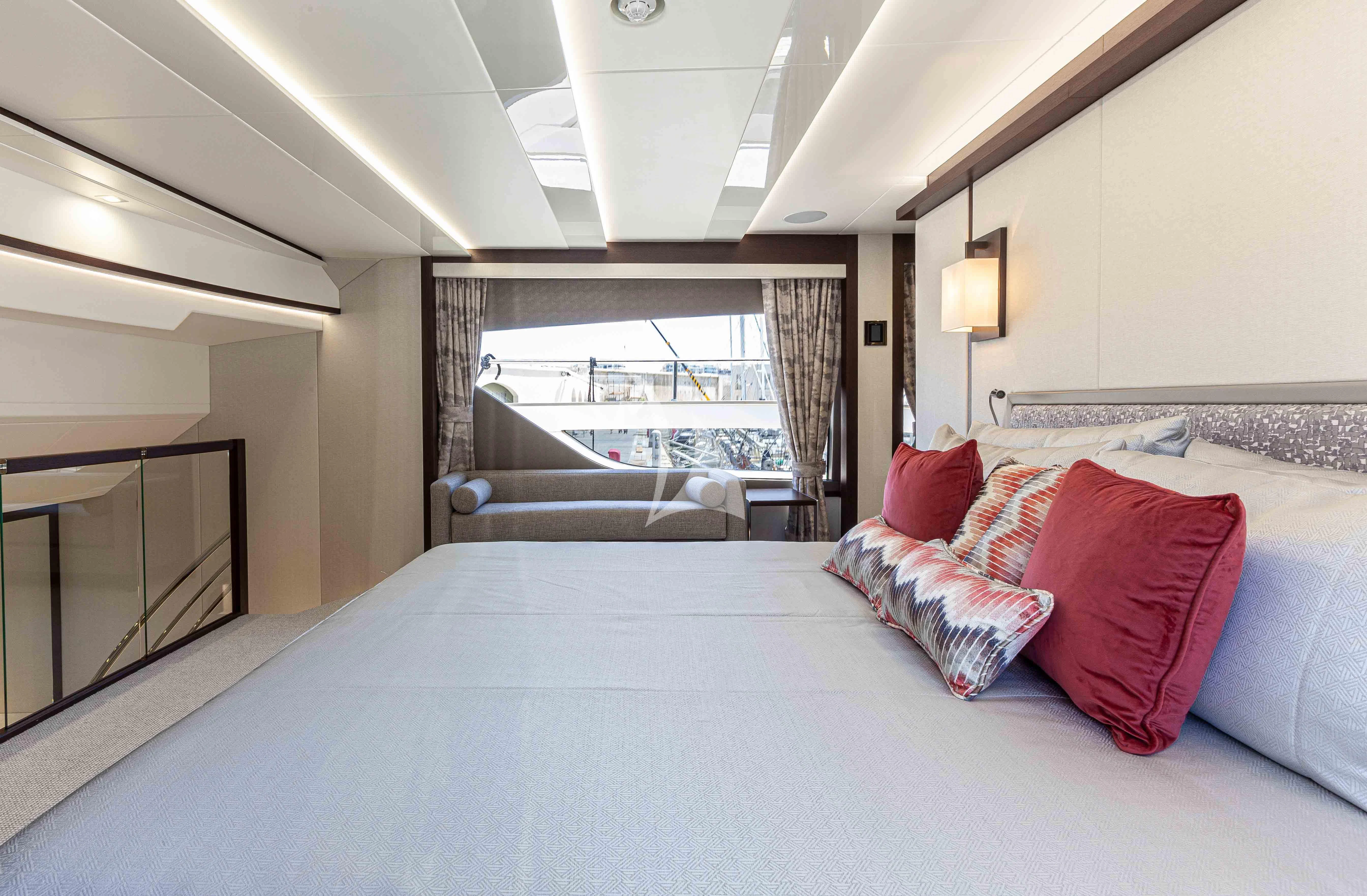 a bed with pillows and a window aboard NEW EDGE Yacht for Sale