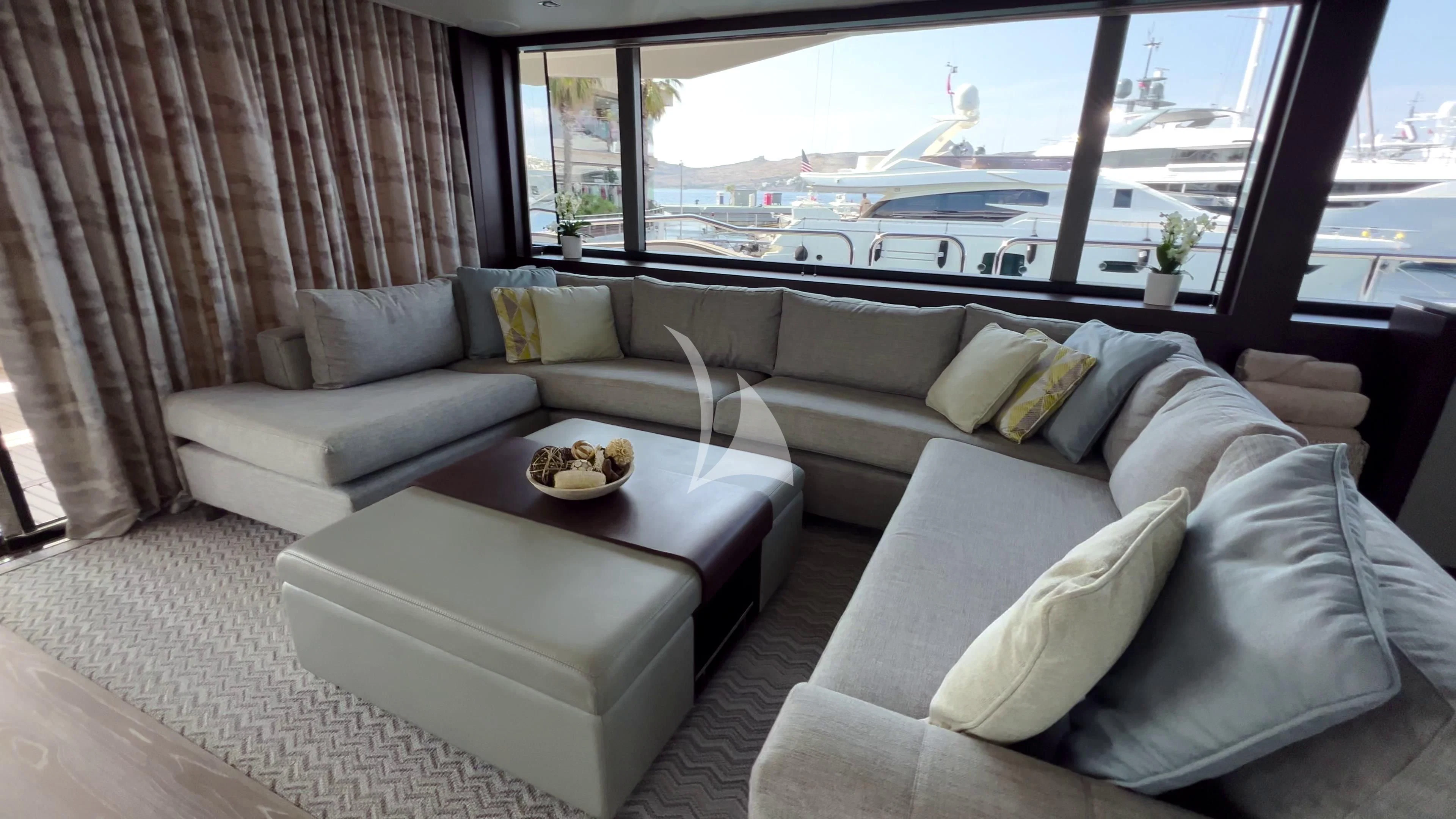 a living room with a large window aboard NEW EDGE Yacht for Sale