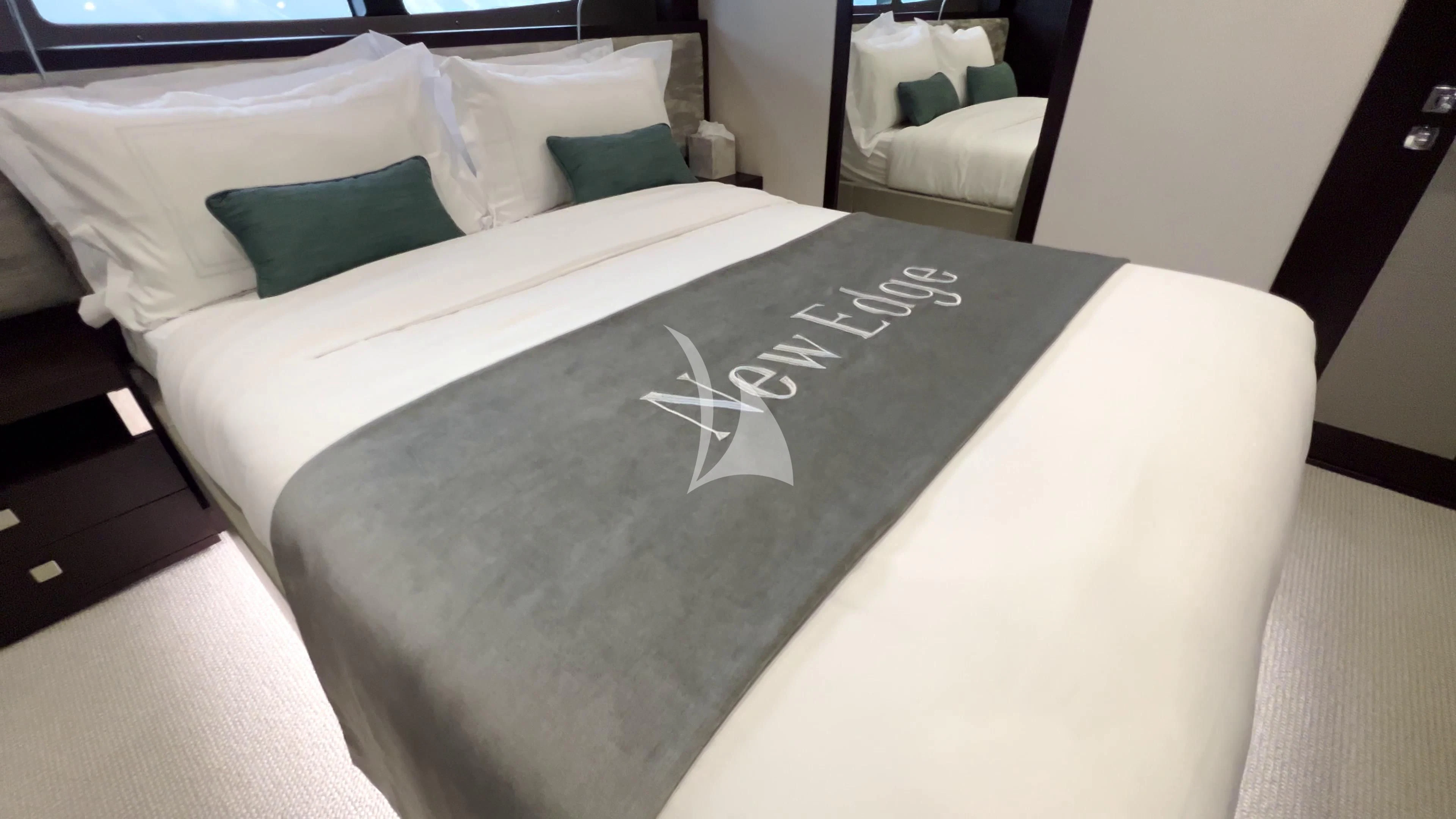 a bed with white sheets aboard NEW EDGE Yacht for Sale