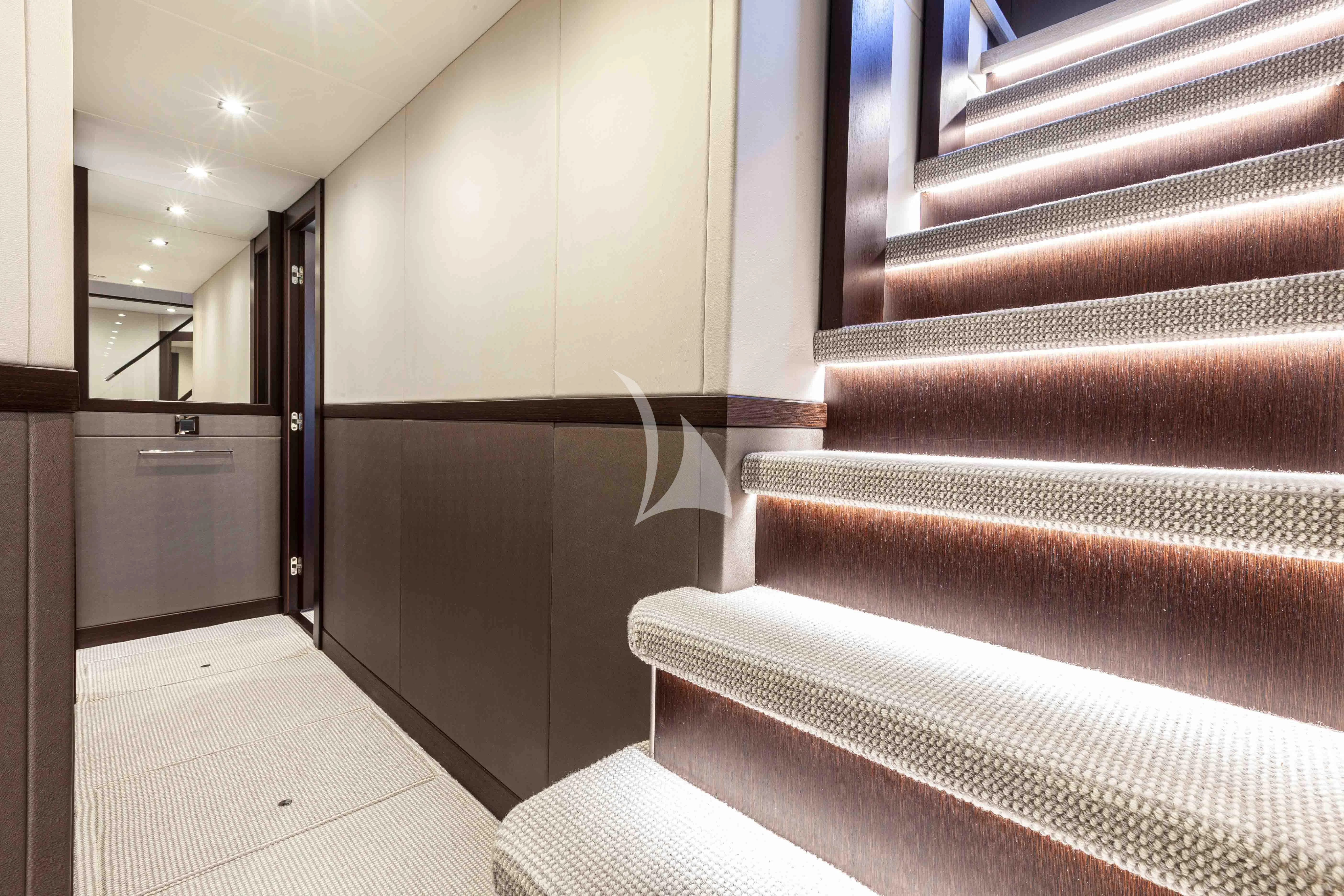 a room with a staircase and a door aboard NEW EDGE Yacht for Sale