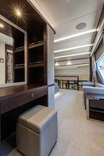 a room with a bench and a table aboard NEW EDGE Yacht for Sale