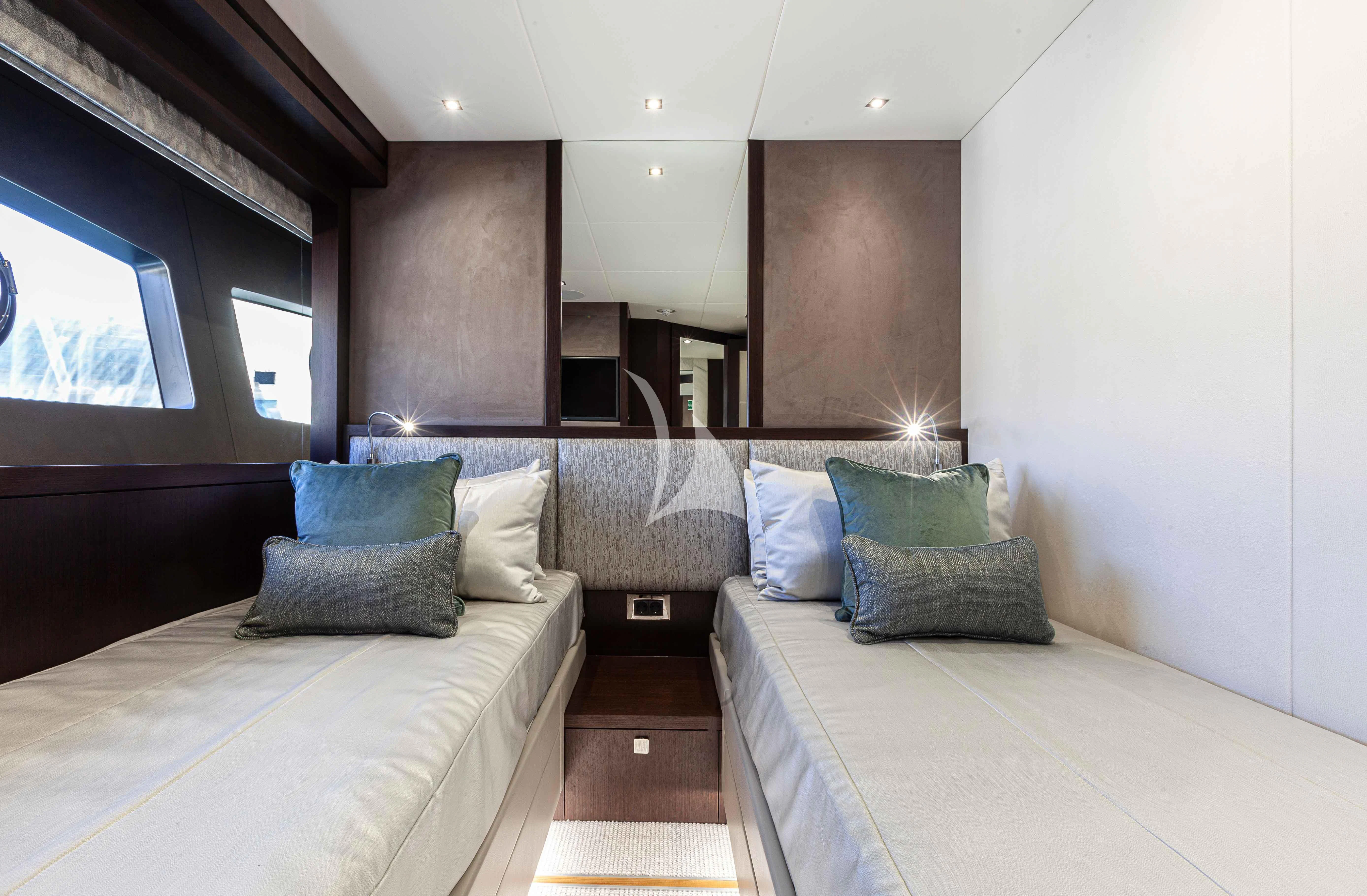 a room with a bed and a couch aboard NEW EDGE Yacht for Sale