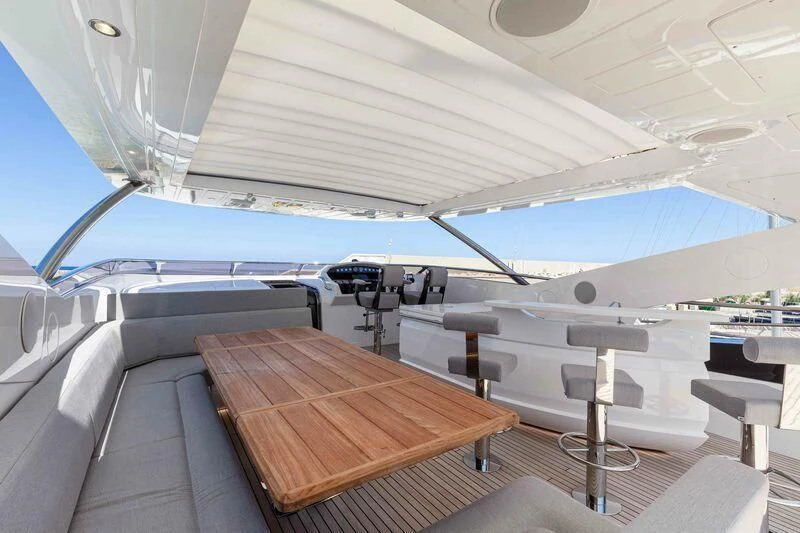 a boat with a deck and chairs aboard NEW EDGE Yacht for Sale