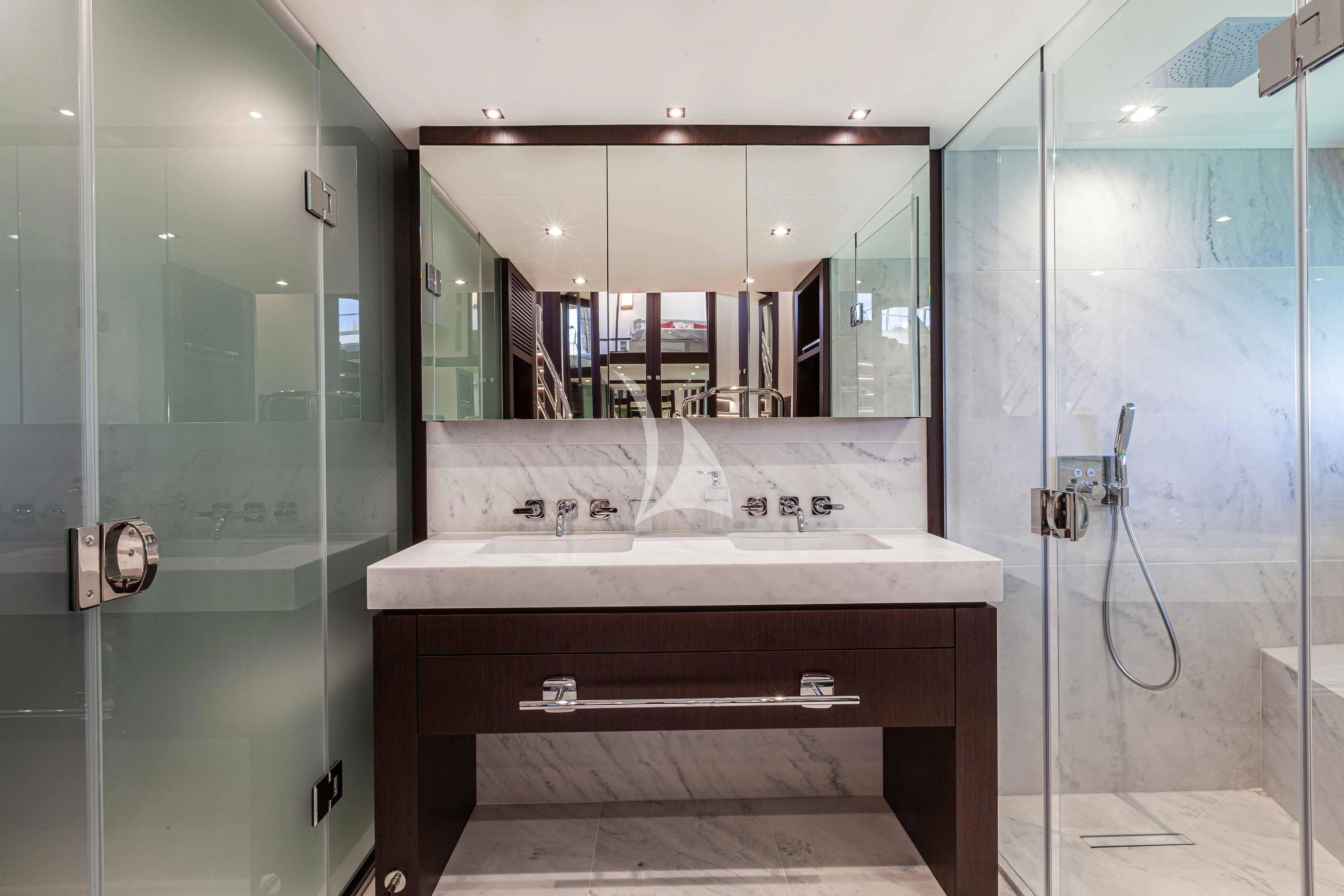 a bathroom with a large mirror aboard NEW EDGE Yacht for Sale