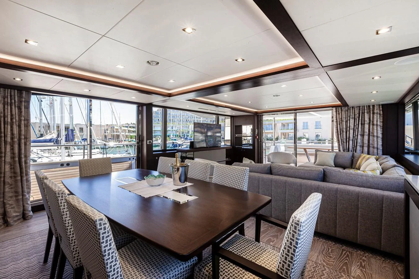a living room with a large glass window aboard NEW EDGE Yacht for Sale