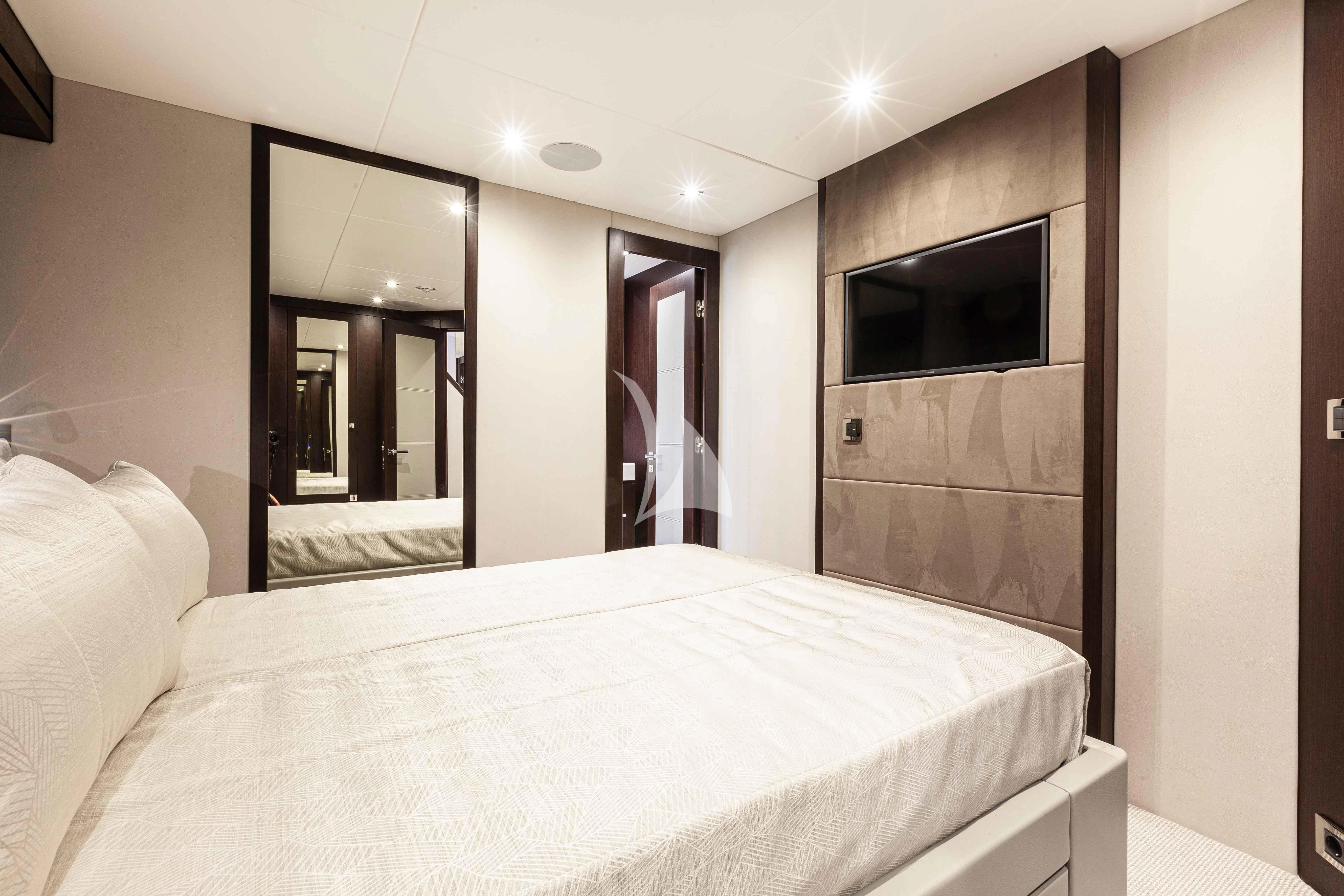 a hotel room with a bed aboard NEW EDGE Yacht for Sale