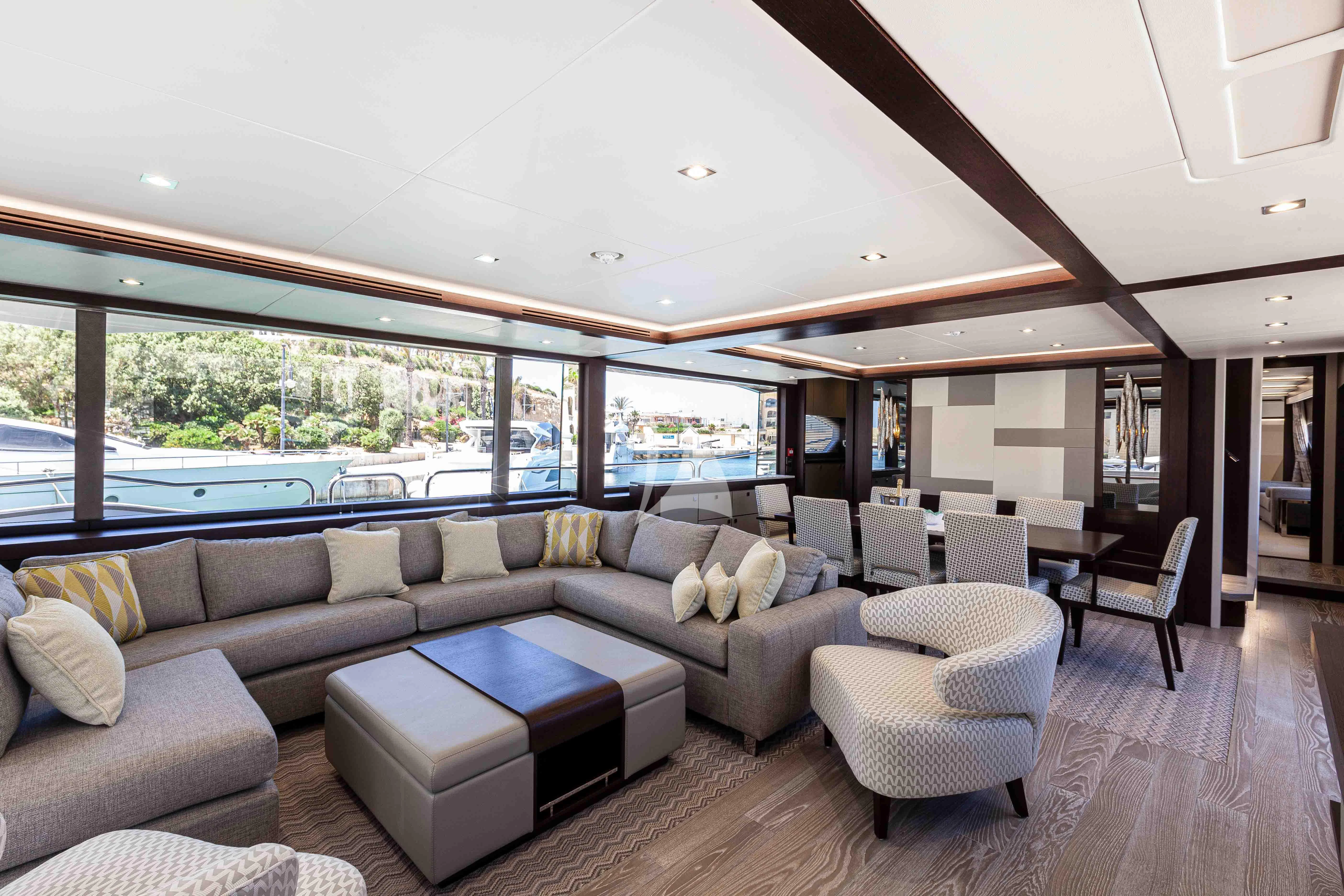 a living room with a large window aboard NEW EDGE Yacht for Sale