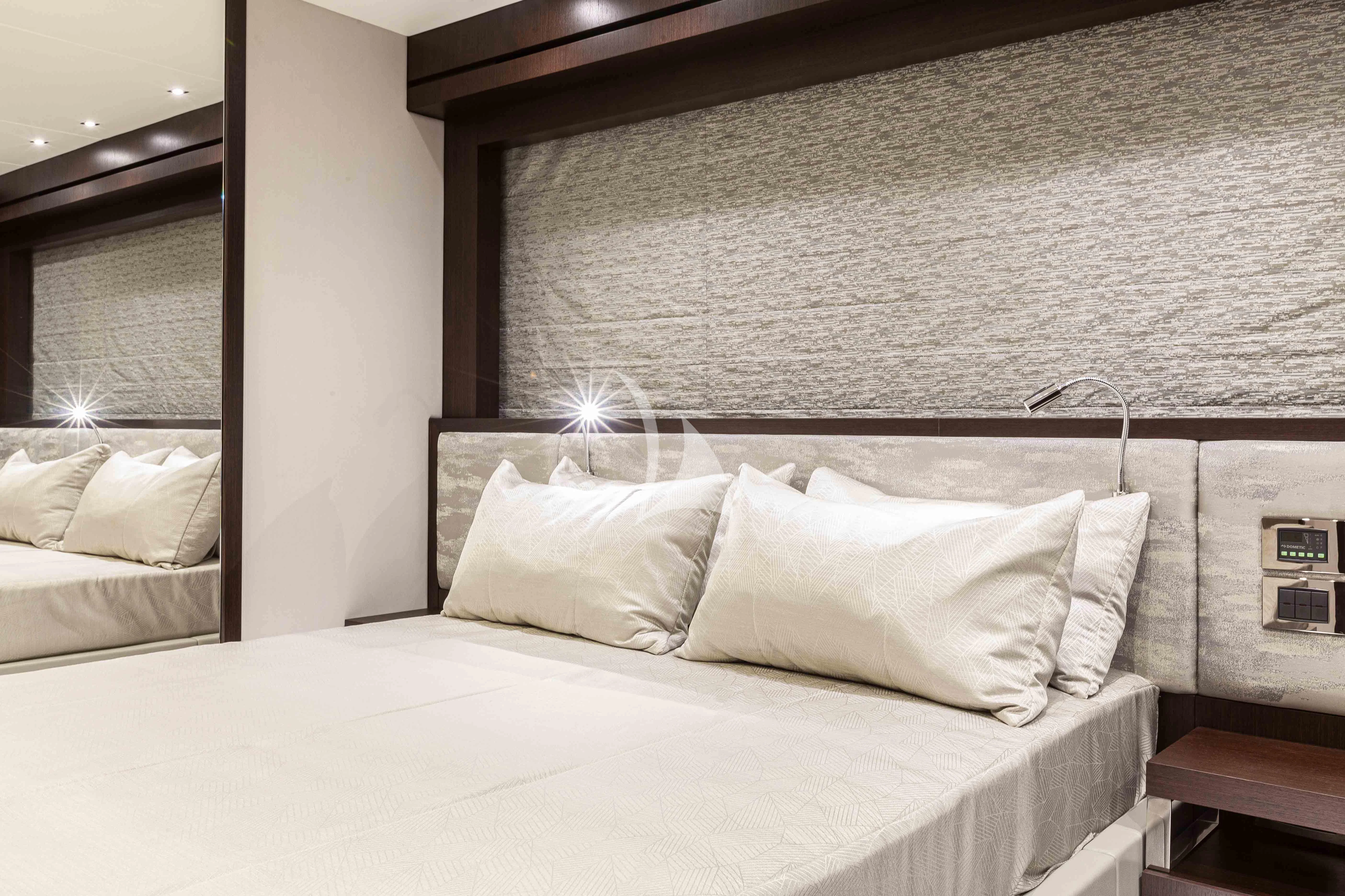 a bed with white sheets aboard NEW EDGE Yacht for Sale