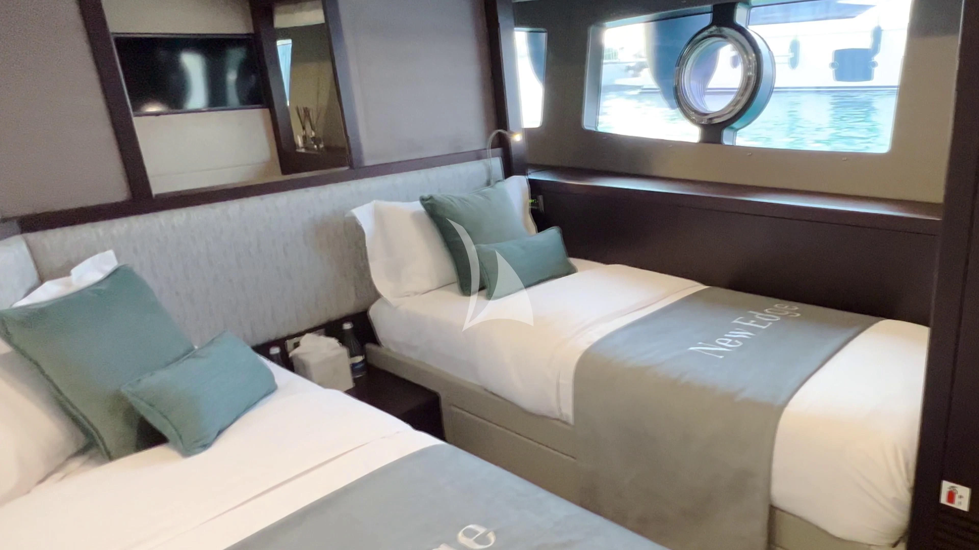 a room with a bed and a window aboard NEW EDGE Yacht for Sale