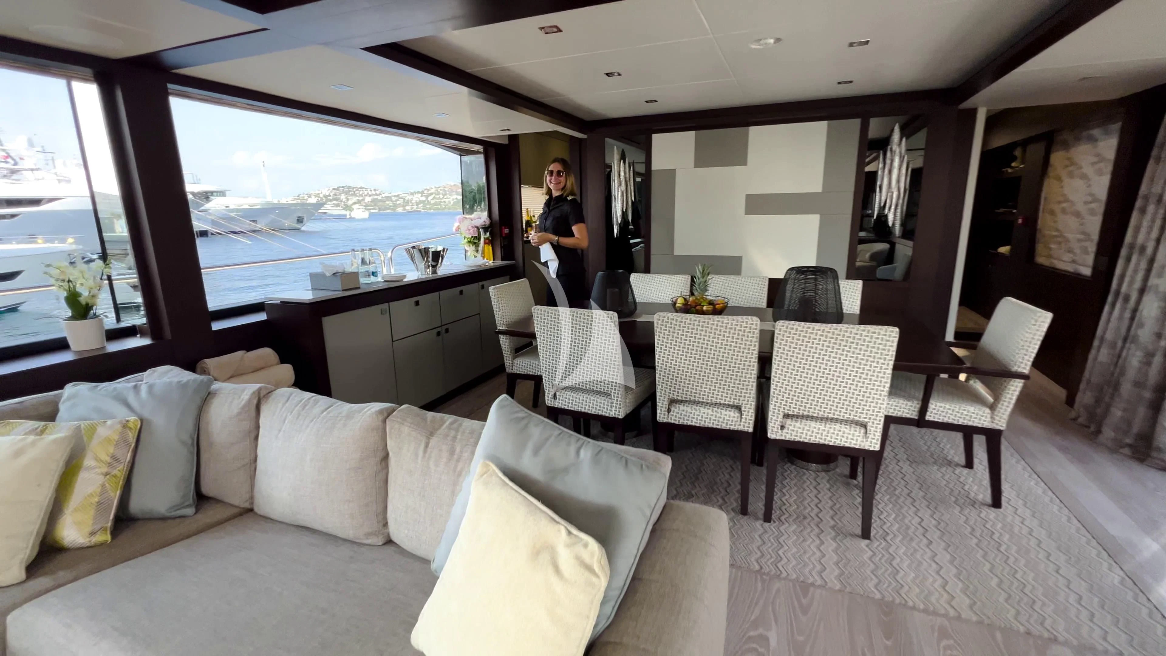 a person standing in a living room aboard NEW EDGE Yacht for Sale