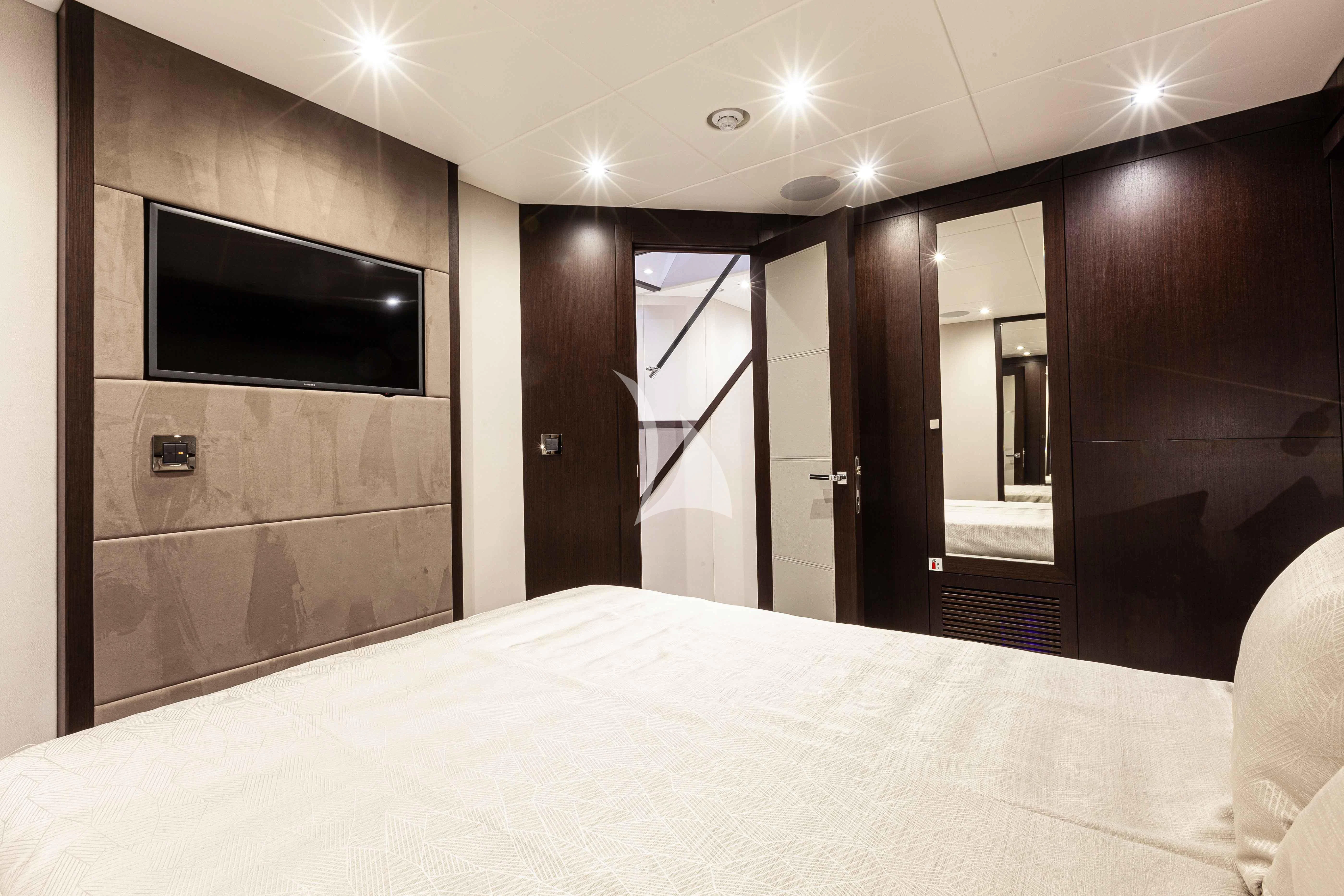 a large hotel room with a large bed and tv aboard NEW EDGE Yacht for Sale